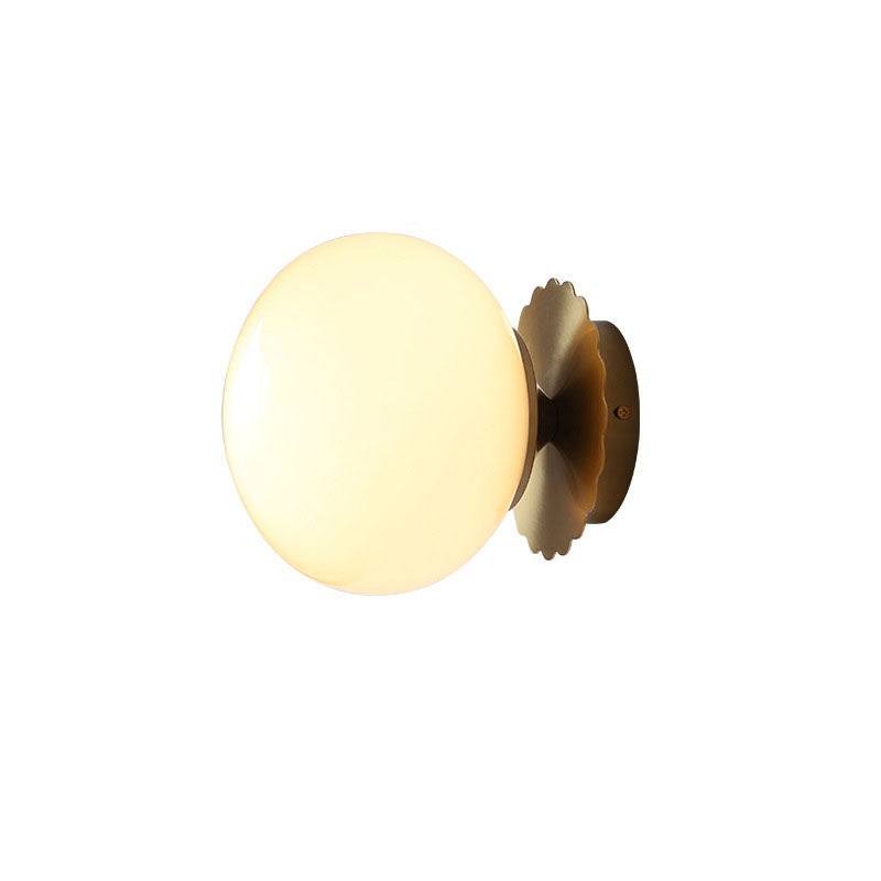 Modern, minimalist 1-light wall lamp made of iron glass with a round head in pink, beige, and white