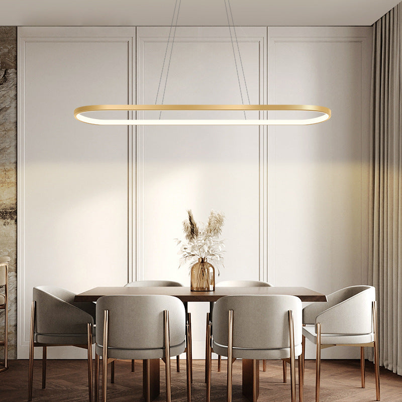 Minimalist Metal Elongated Gold-Plated Pendant Light Taavita Over Table