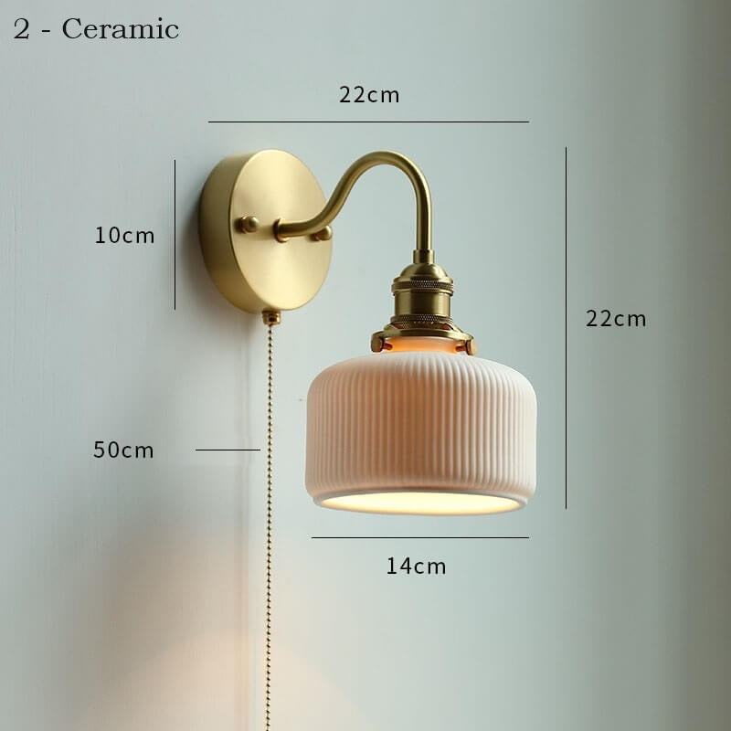 Ceramic adjustable wall lamp with pull chain switch, mounted on a copper fixture.