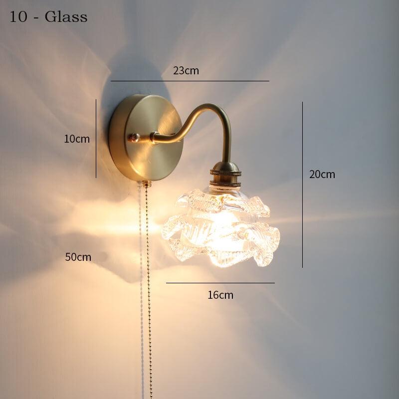 Adjustable glass wall lamp with pull chain switch, featuring a copper holder for durability and style.