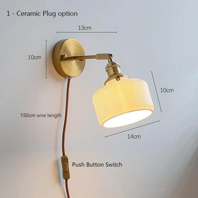 Modern ceramic wall lamp with pull chain switch, mounted on a copper fixture.