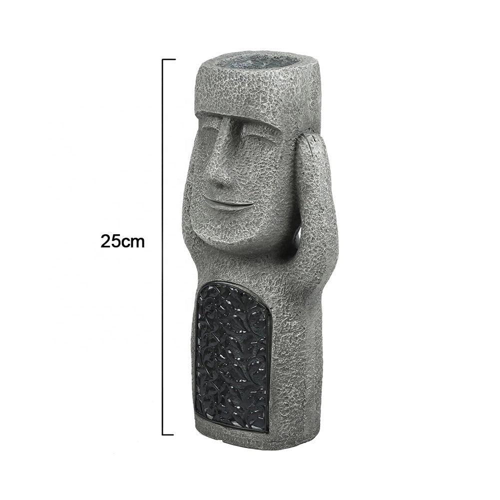 Granite Moai statue replica resembling Easter Island sculptures, measuring 25cm in height, designed for garden decor.