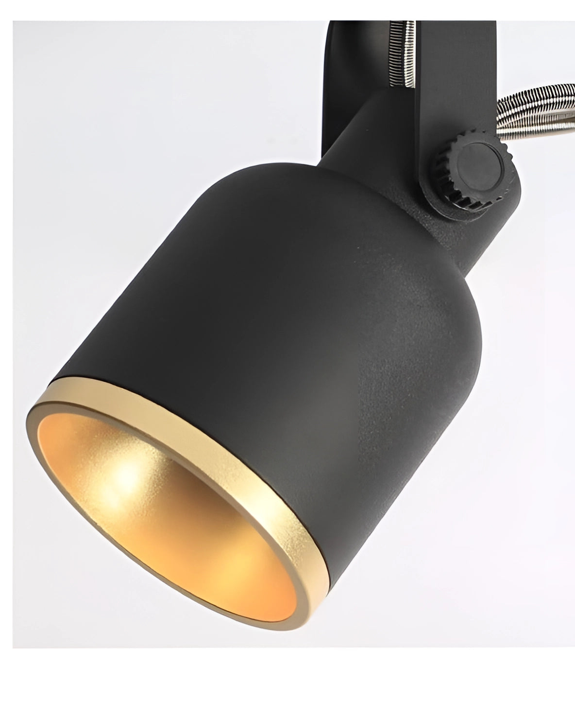 Adjustable black and gold LED track light mounted on the ceiling showcasing a modern cylindrical design.