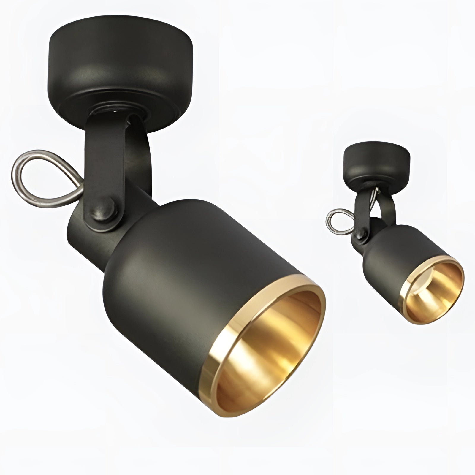 Adjustable black and gold LED track light with a modern cylindrical design, mounted on the ceiling, emitting warm white light.