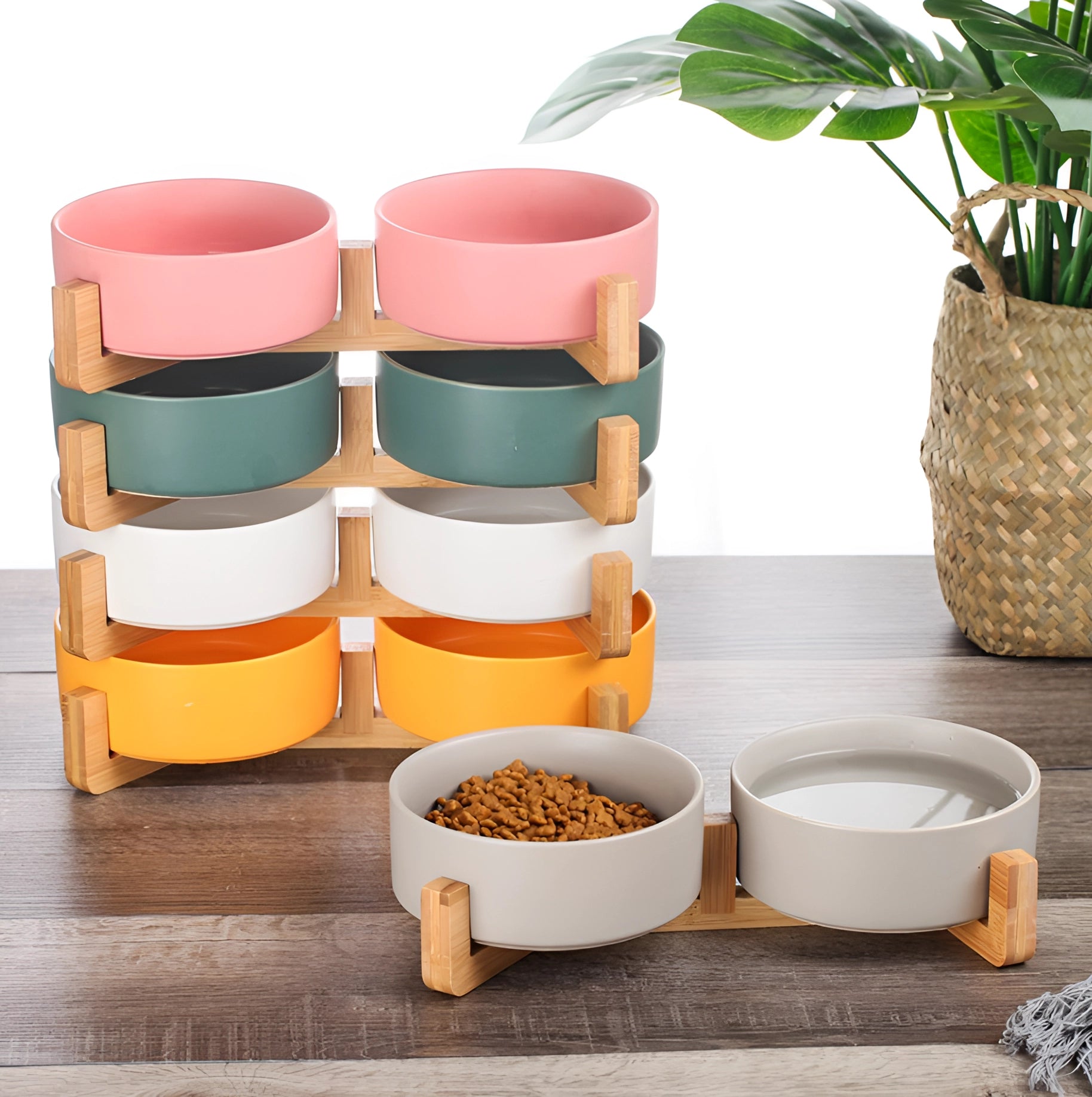 Adjustable multi-level bamboo pet feeder with two colorful dishes, suitable for food and water, designed for pets; features a sleek, rectangular shape and vibrant color accents.