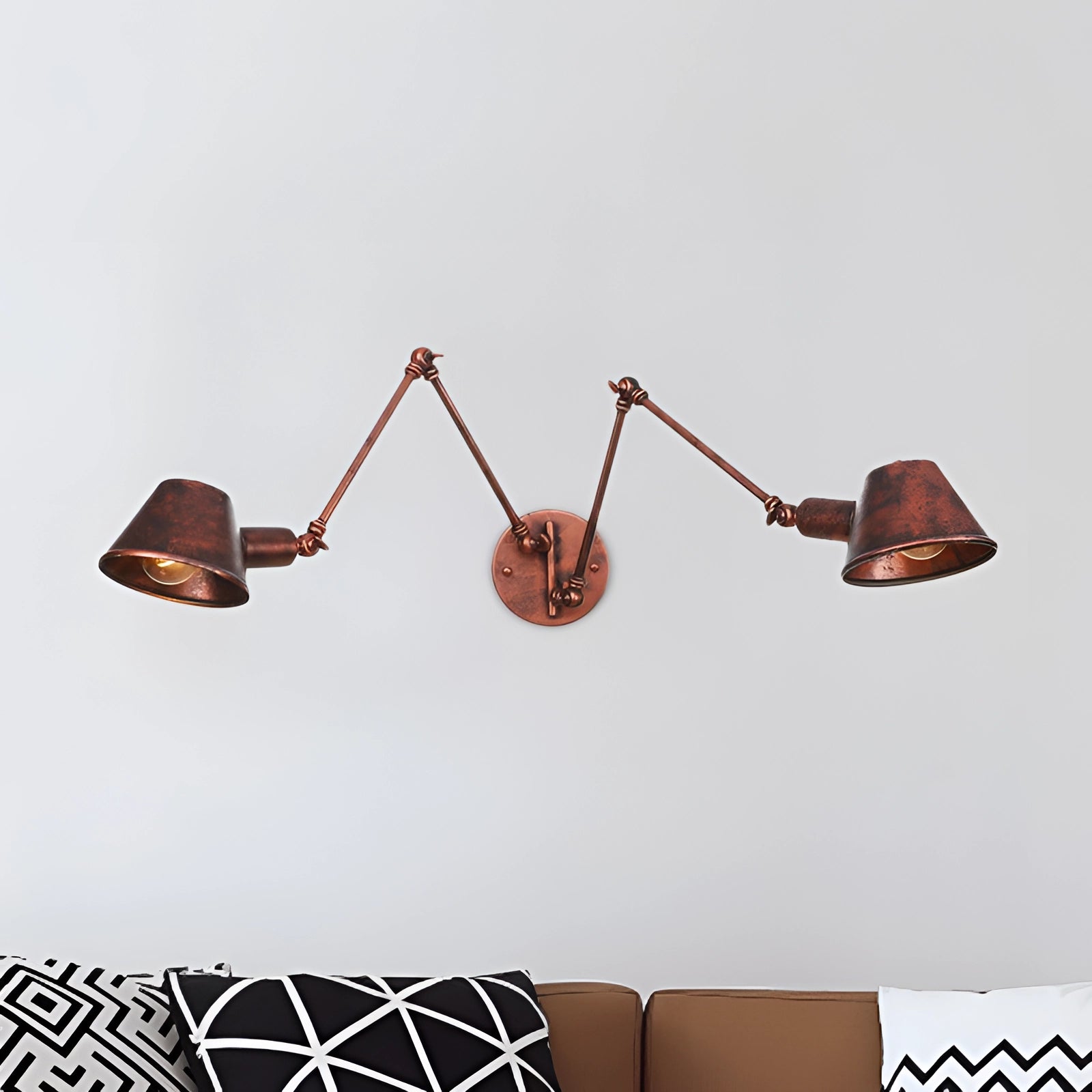 Adjustable triple-arm black wall sconce with a modern industrial design featuring a rust finish and two lights.