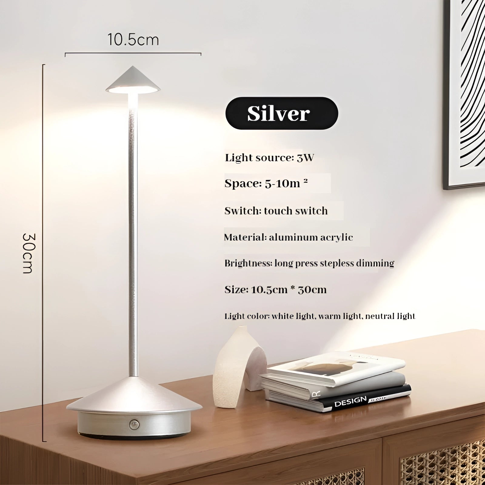 
Silver aluminum touch table lamp with a modern design, featuring a 3W LED light and stepless dimming, placed on a wooden table in an interior setting.