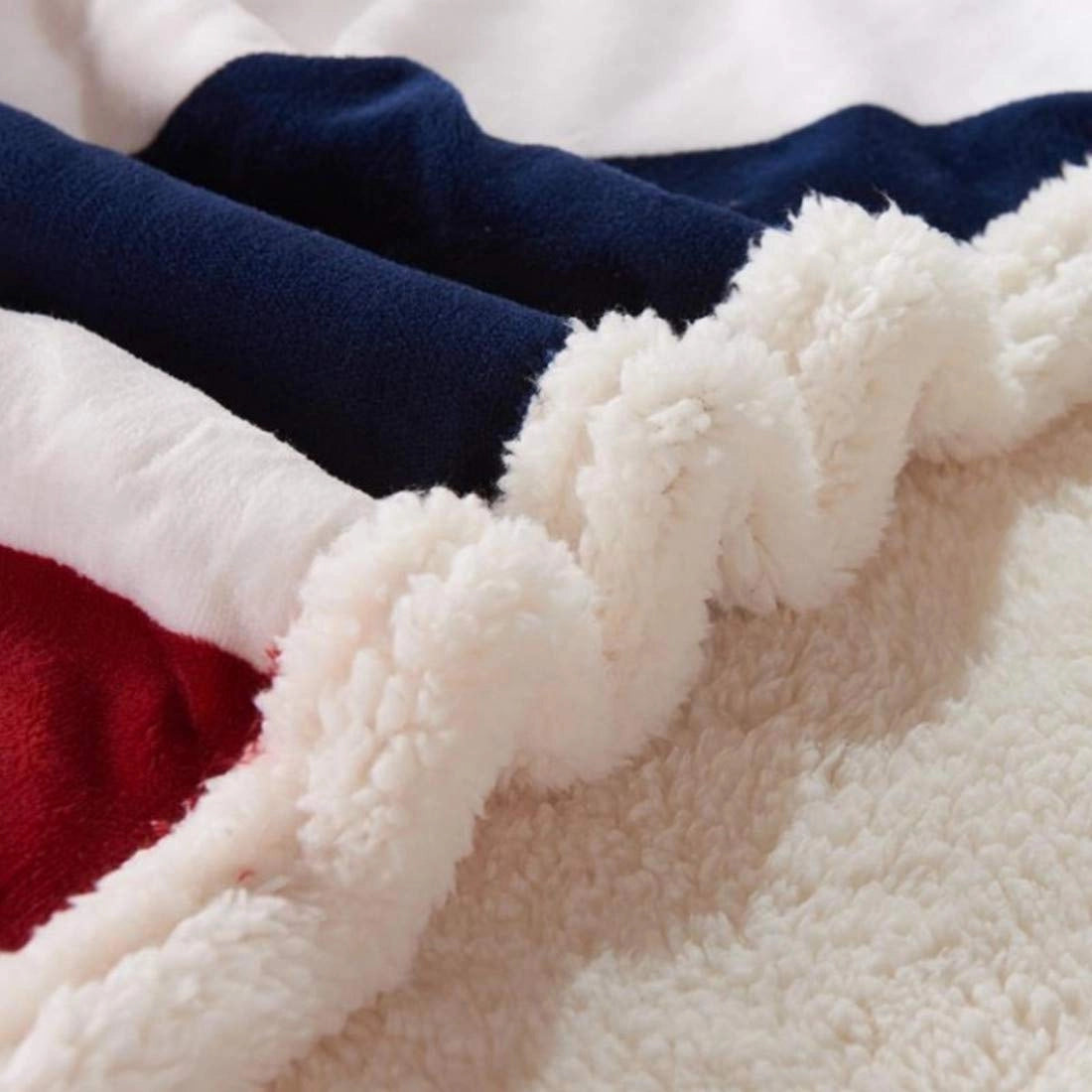 Cozy fleece blanket featuring a patriotic design with American flag stars and stripes pattern.