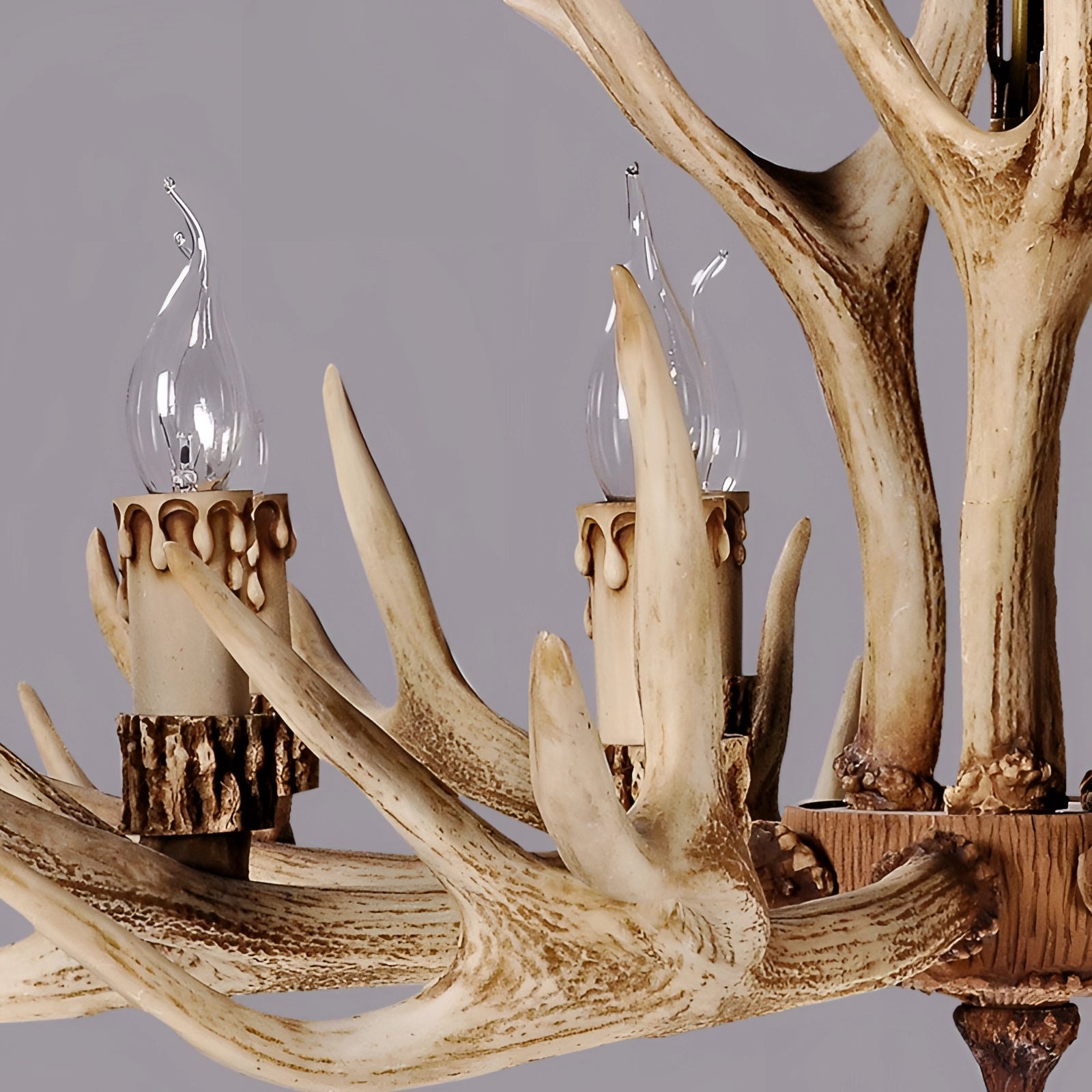 Antler chandelier crafted from natural wood and horn materials, featuring a rustic design suitable for lodge or cabin decor and lighting.