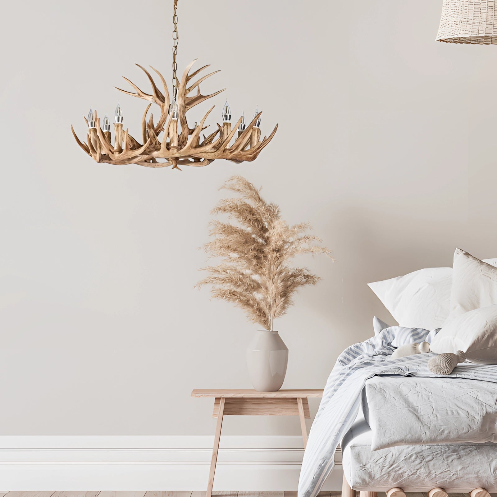 A rustic antler chandelier made from natural wood materials, featuring twig-like designs, hanging in a stylishly decorated interior space with a cozy and comfortable ambiance.