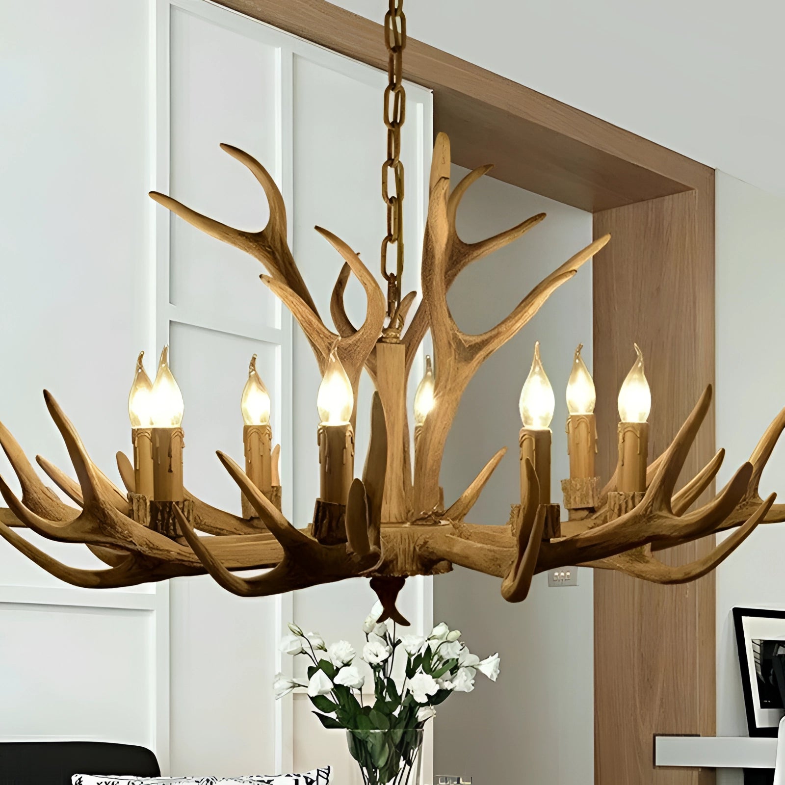 Antler chandelier with a rustic lodge cabin design, featuring a coffee-colored finish and eight lights, crafted from natural materials and mounted on the ceiling as a decorative lighting fixture.