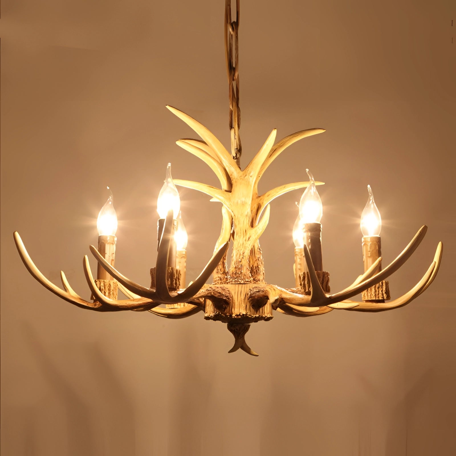 Rustic antler chandelier with a coffee finish featuring six lights, made from natural materials with wood and metal elements, designed for interior decor and ceiling installation in lodge or cabin settings.