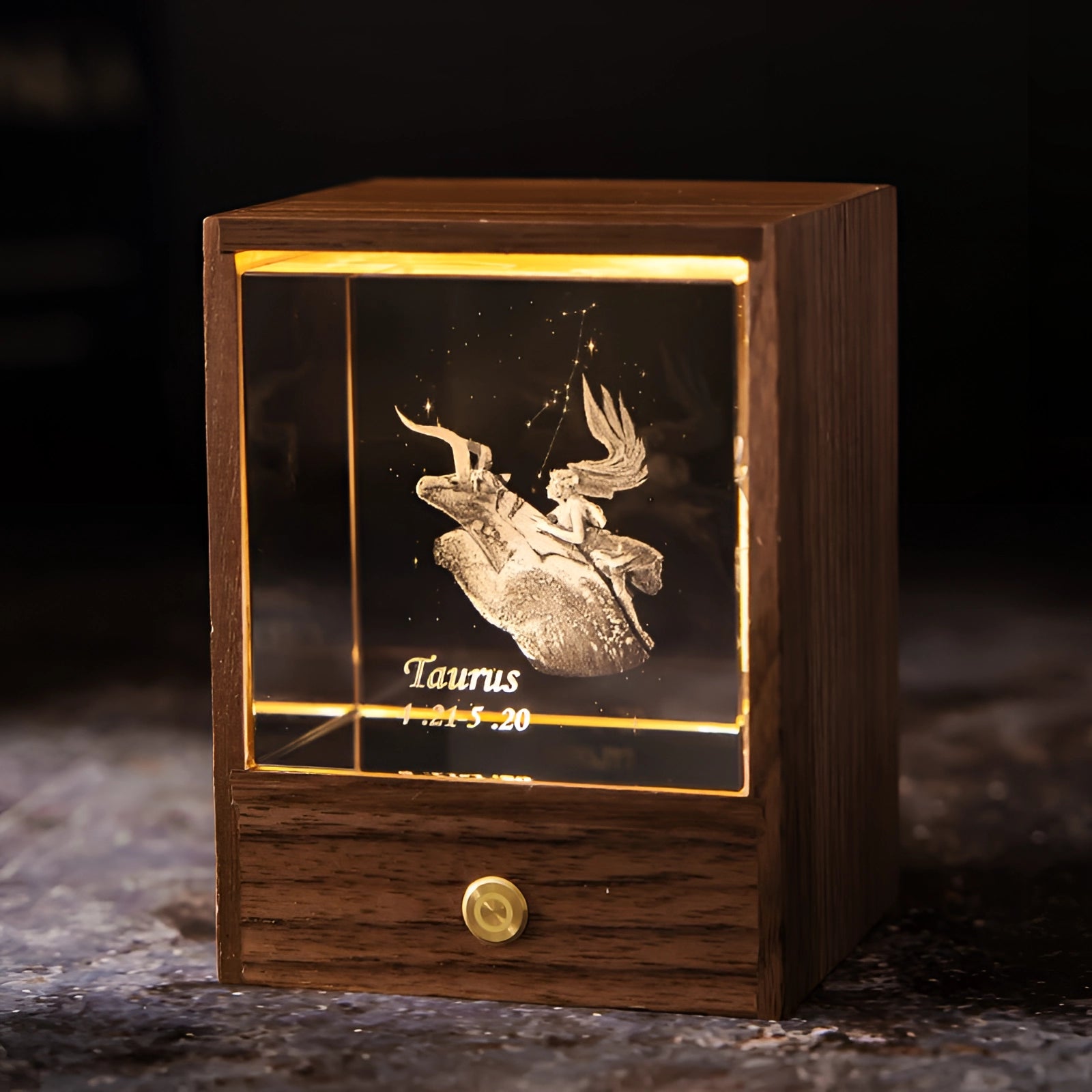 
A personalized Aquarius Zodiac LED Night Light featuring intricate artwork of a bull, crafted from brown-stained wood with a rectangular shape, illuminated in a dark setting.