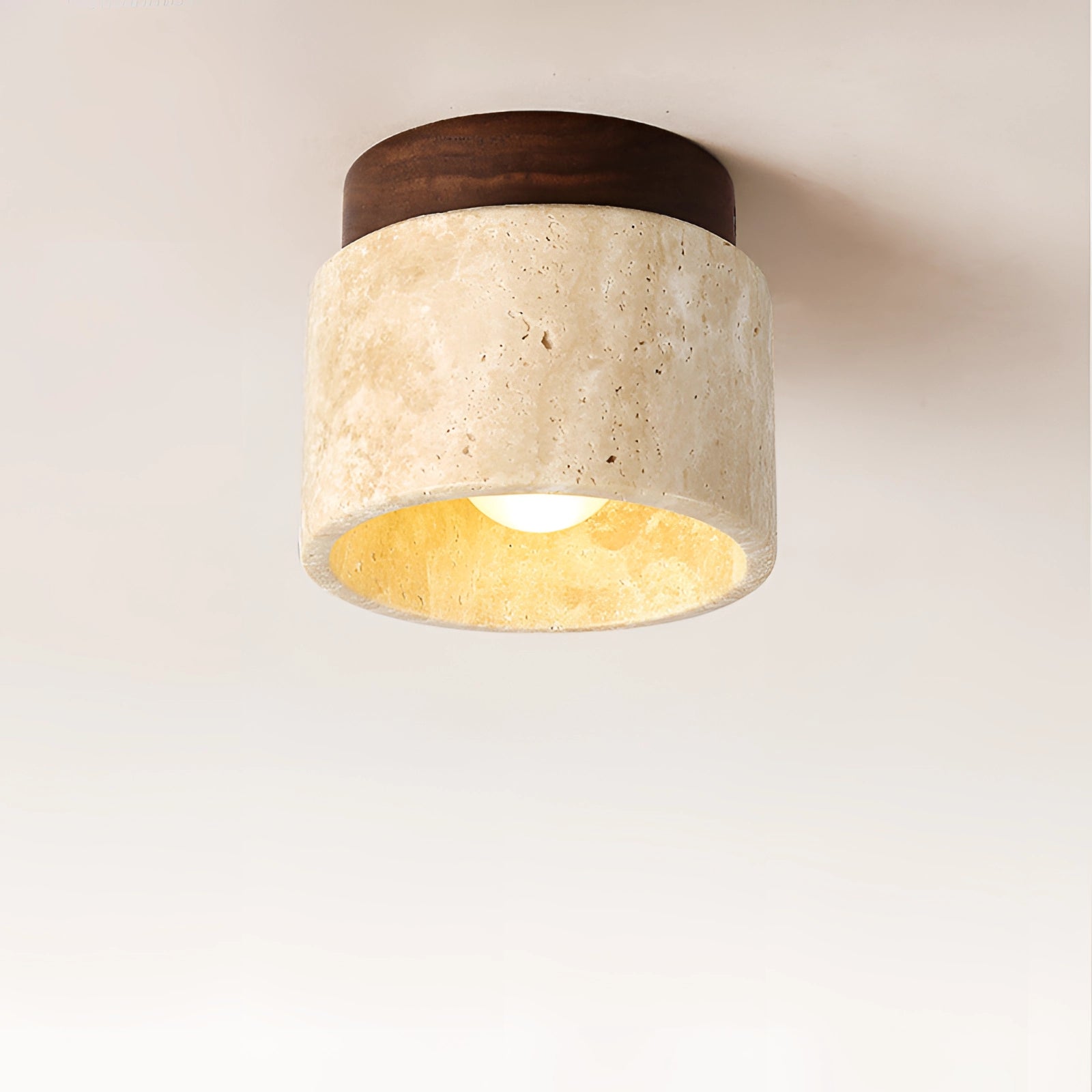 Artisan Stone Finish Eco-Friendly Flush Mount Ceiling Light featuring a cylindrical beige stone-like design with metal accents, suitable for ceiling installation.