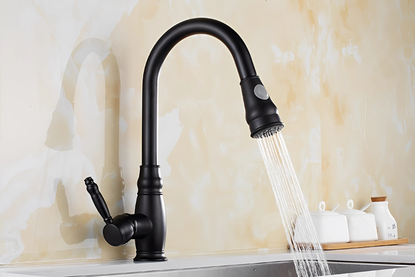 Black kitchen faucet with pull-down sprayer and single handle, eco-friendly design, set against a wooden countertop backdrop.