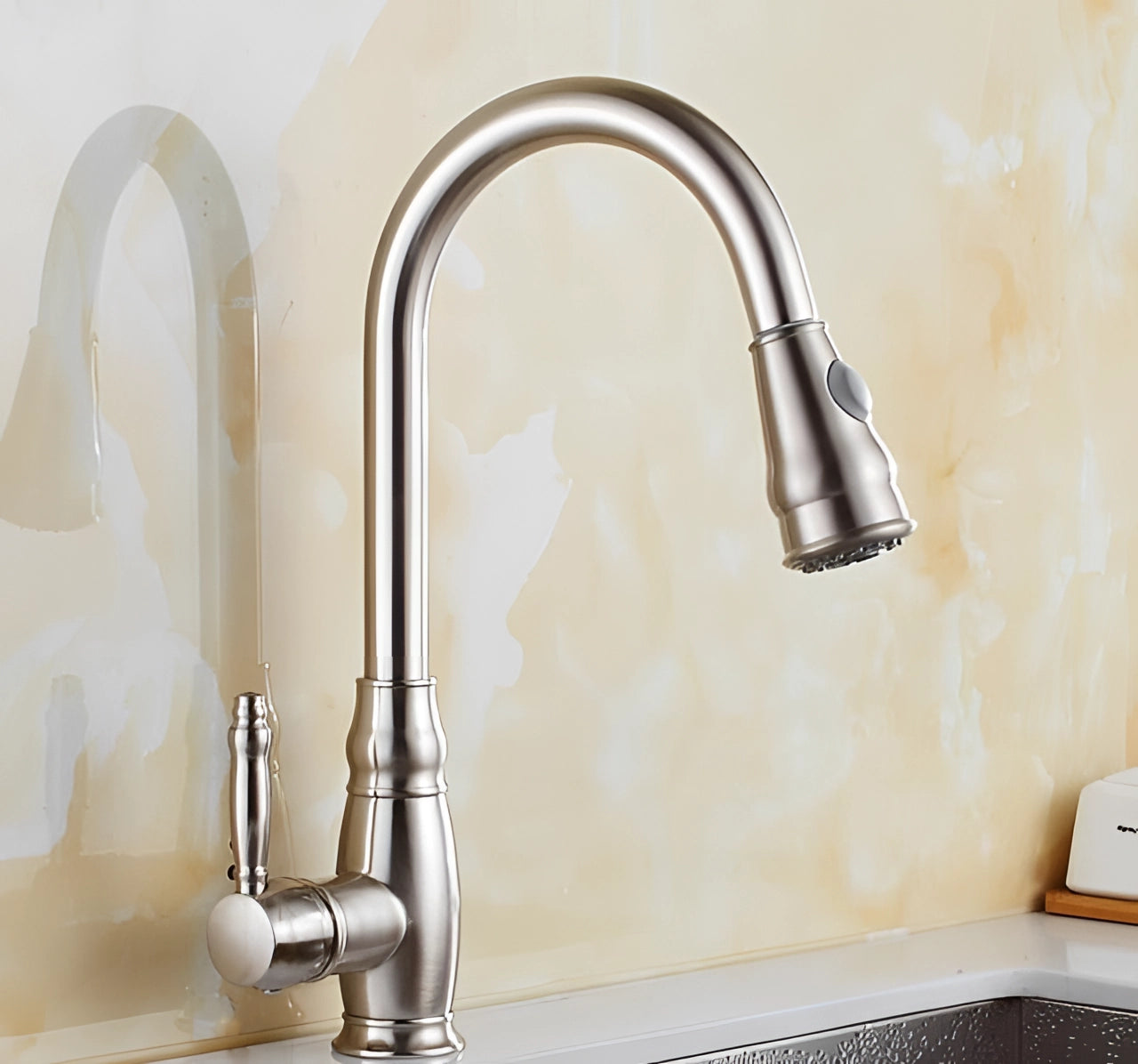 Black kitchen faucet with a pull-down sprayer and single handle in a nickel finish, featuring eco-friendly design, suitable for modern kitchens.