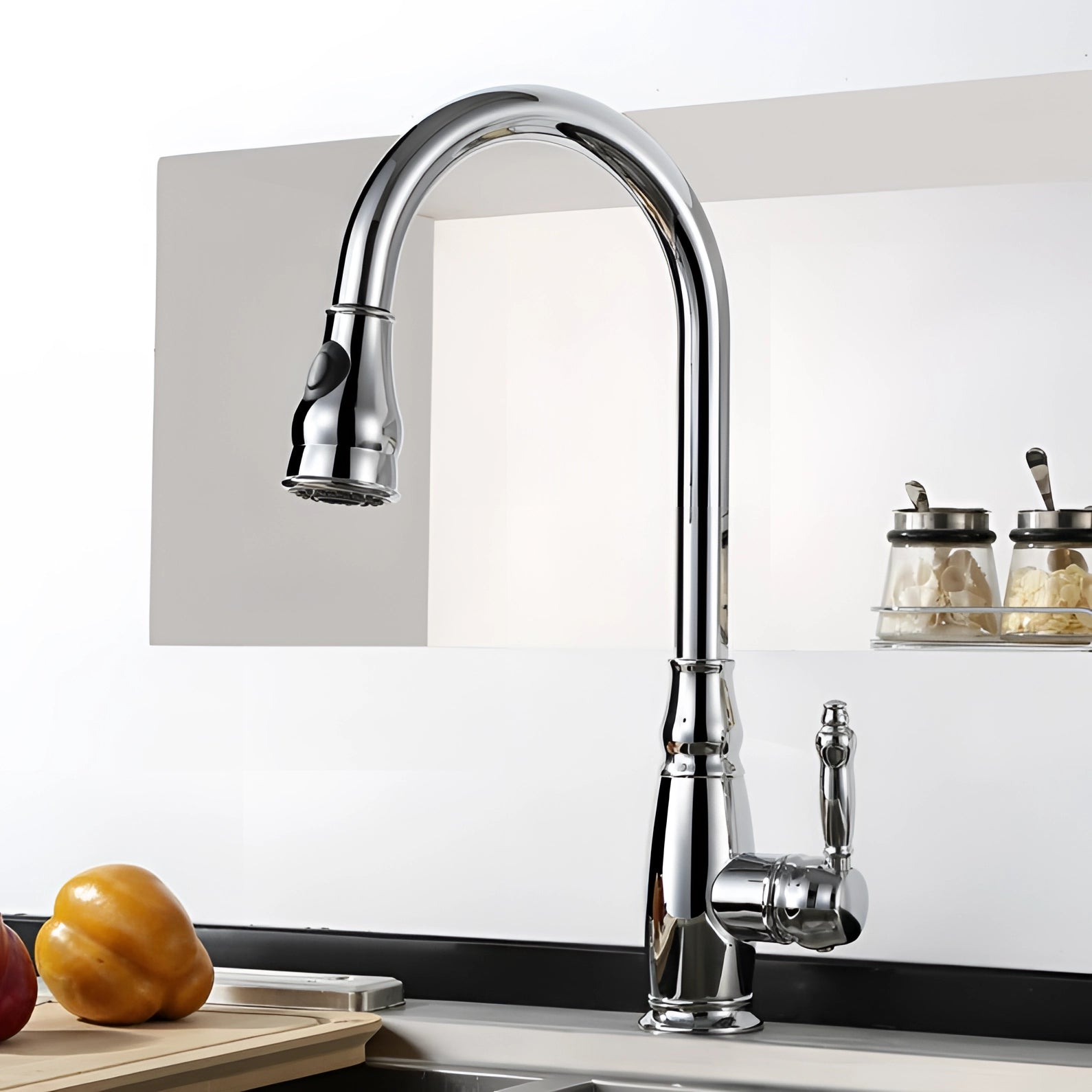 Black kitchen faucet with a pull-down sprayer and single handle in a sleek chromium finish, installed over a rectangular grey sink.