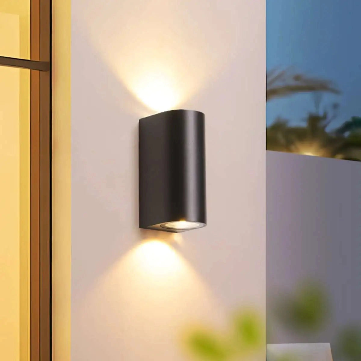 Black LED Cylindrical Outdoor Wall Lamp mounted on a wooden wall with modern weather-resistant sconce design.