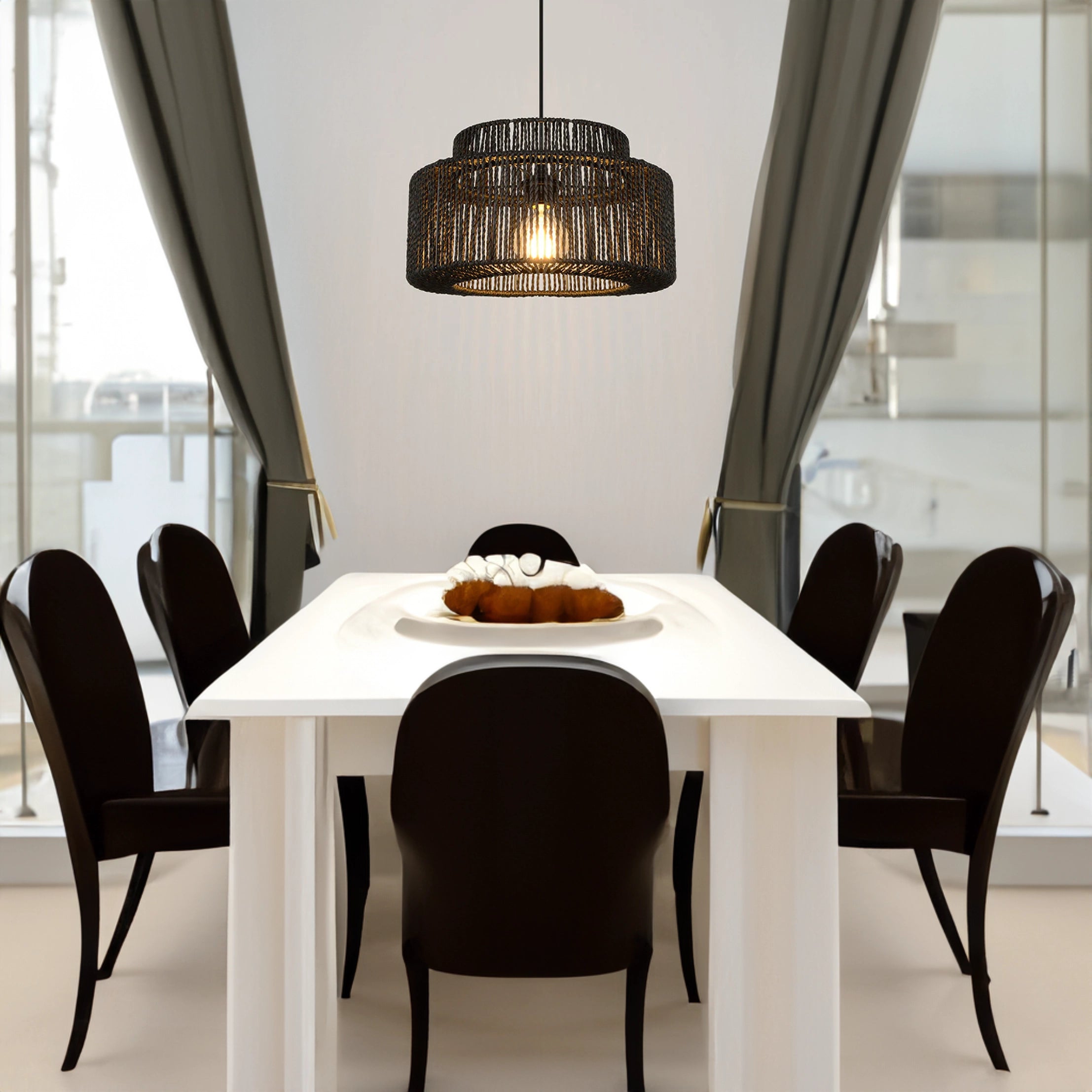 Black Rattan Woven Pendant Light hanging over a wooden dining table in a contemporary living room setting.