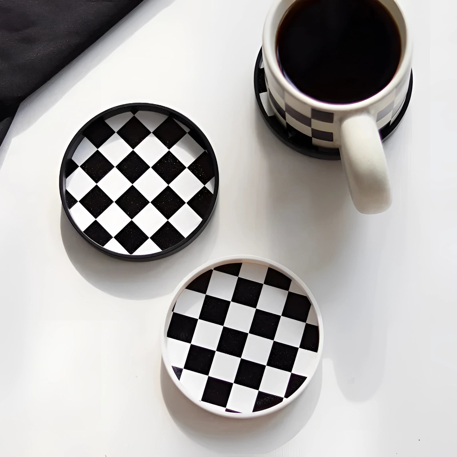 Black and white checkered ceramic trinket dish with a circular shape, designed as a 10cm jewelry holder, featuring a geometric pattern.