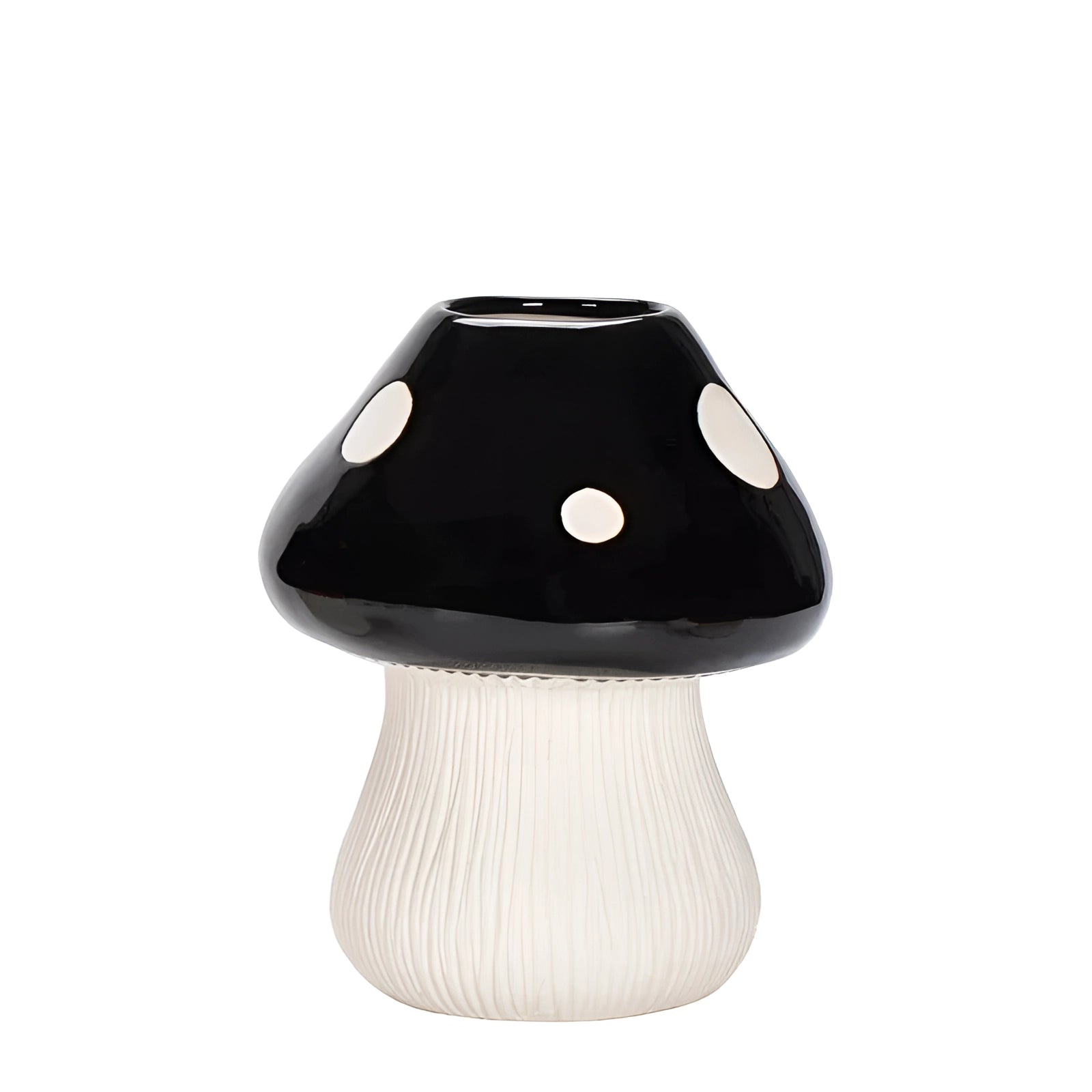 Black and white polka dot ceramic mushroom-shaped table lamp with a whimsical design, featuring a circular pattern on its cap and a sleek black stem, placed on a flat surface.