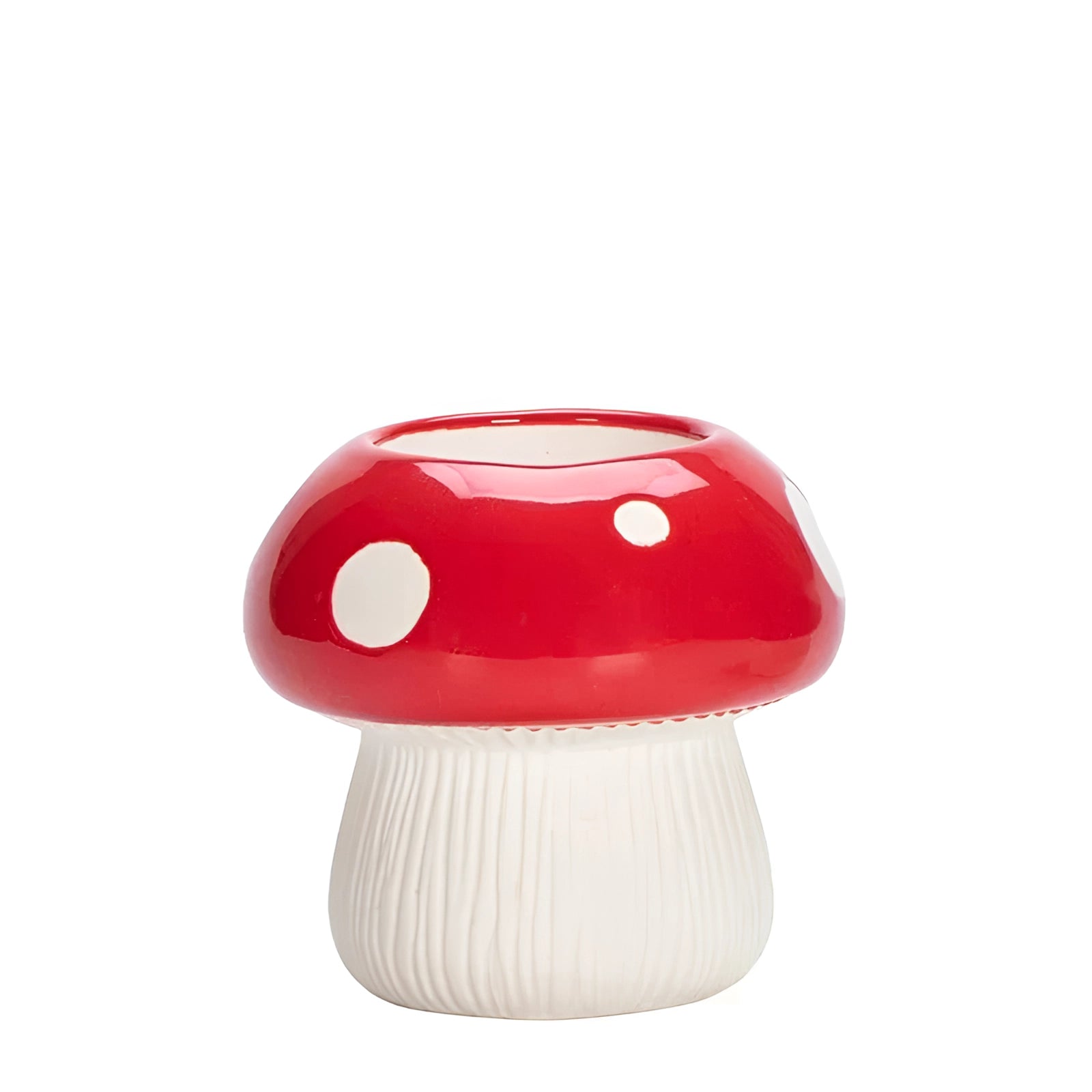 A whimsical decor piece featuring a black and white polka dot ceramic mushroom-shaped table lamp with a playful design.