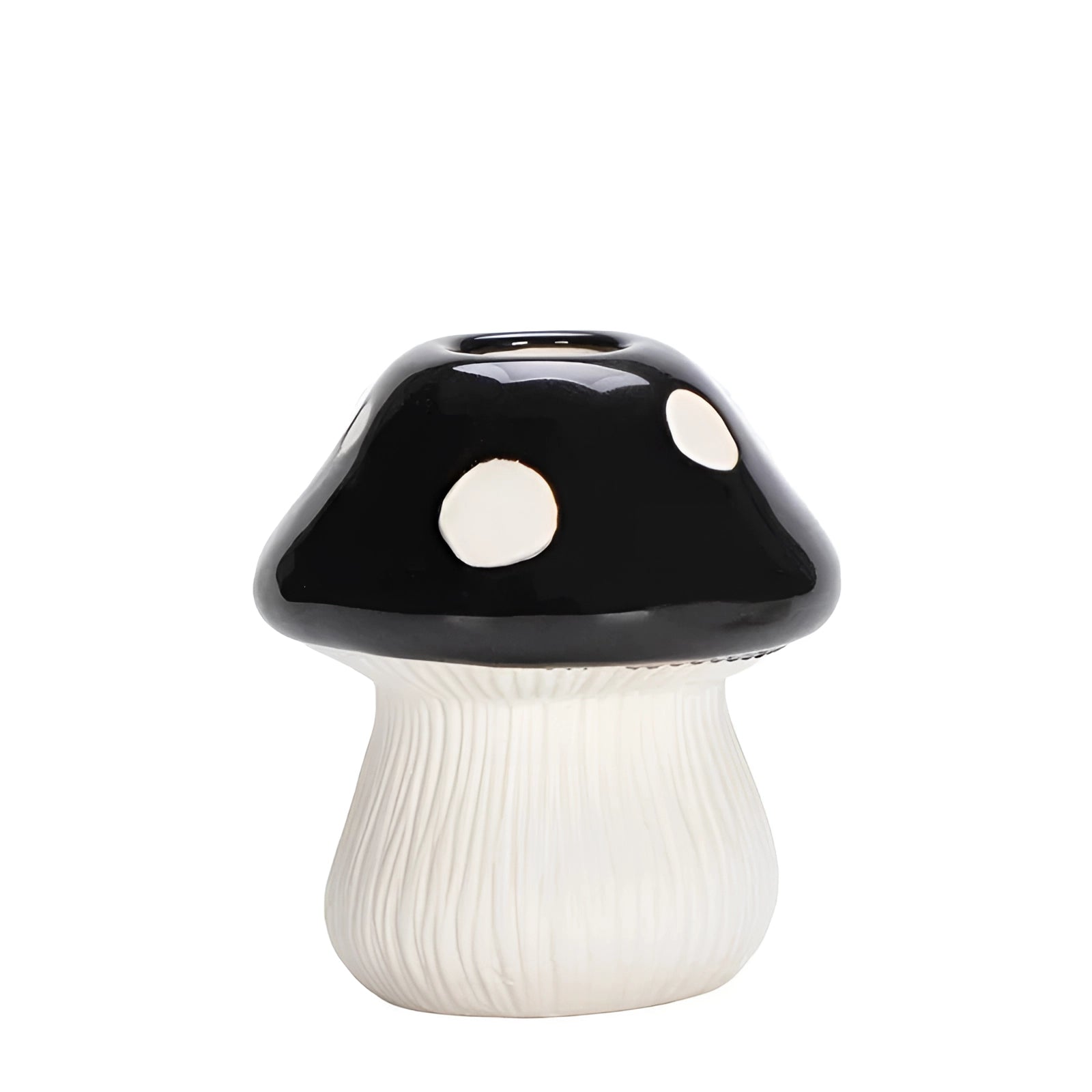 A whimsical black and white polka dot ceramic mushroom table lamp with a unique and playful design, perfect for adding a touch of charm to any space.