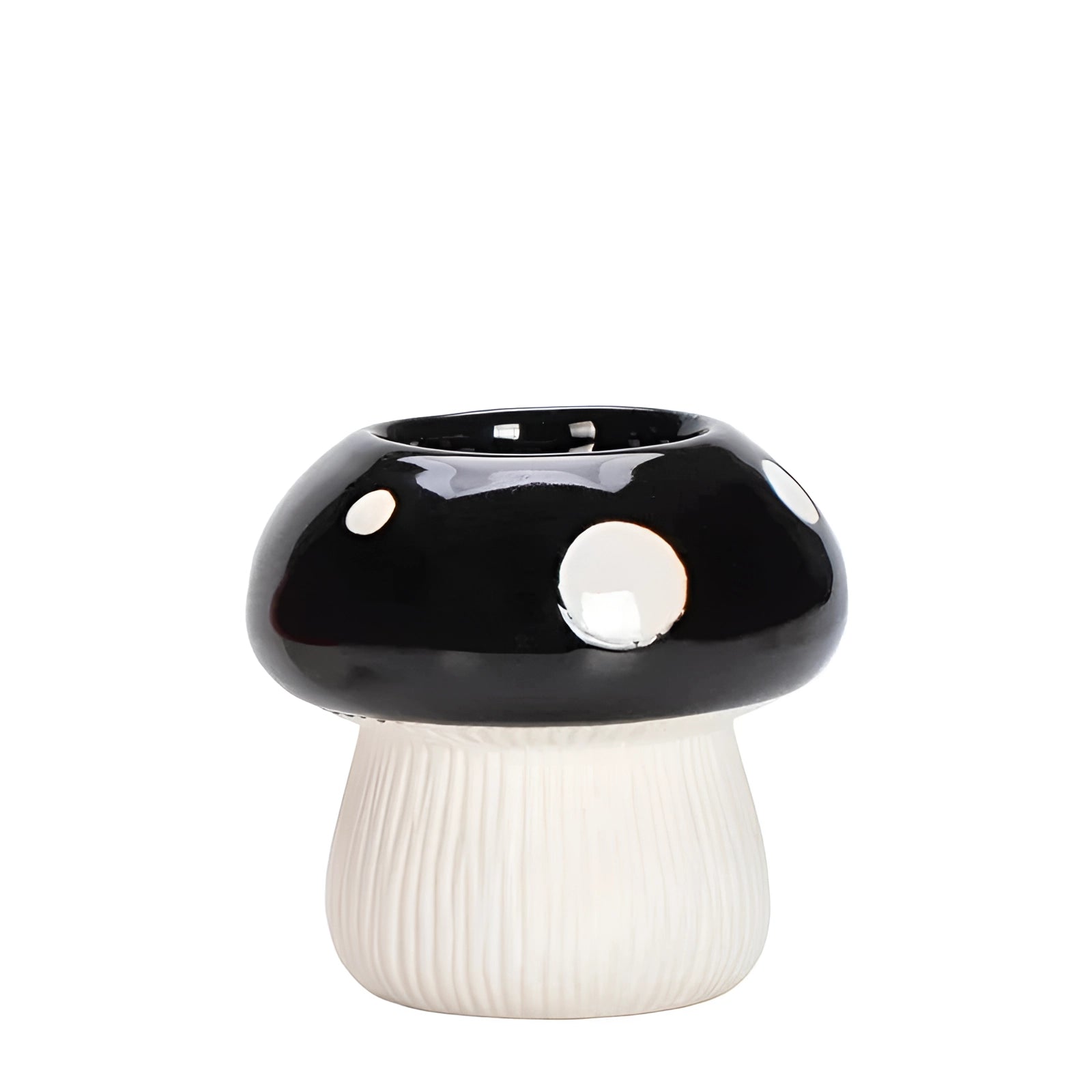 Ceramic mushroom table lamp with a black and white polka dot design, perfect for adding whimsical decor to a space.