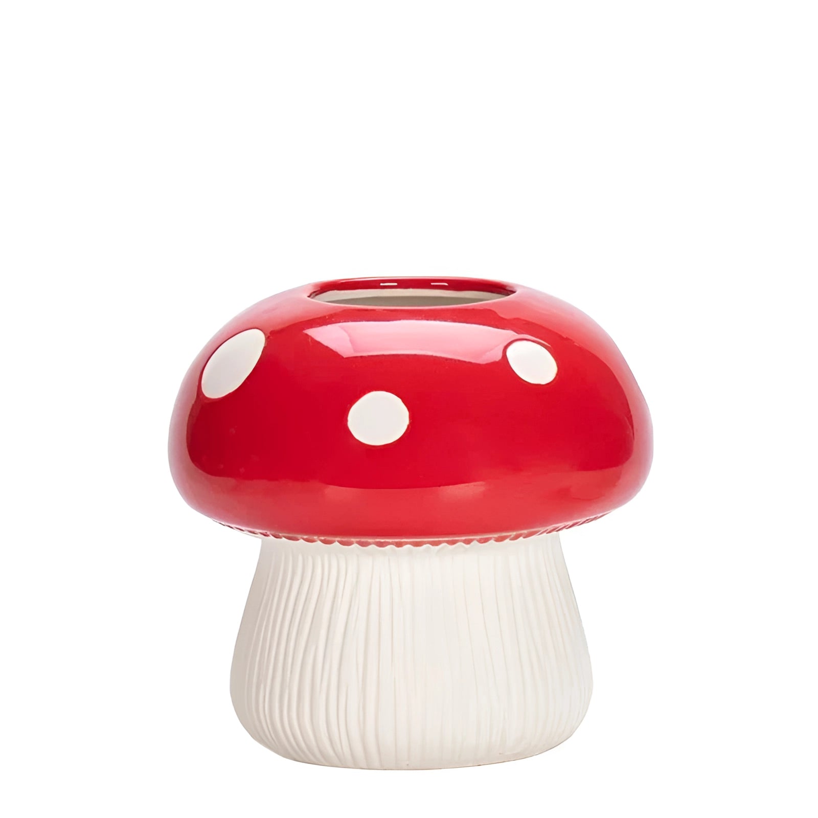 A whimsical ceramic table lamp featuring a red mushroom-shaped design with a black and white polka dot pattern.