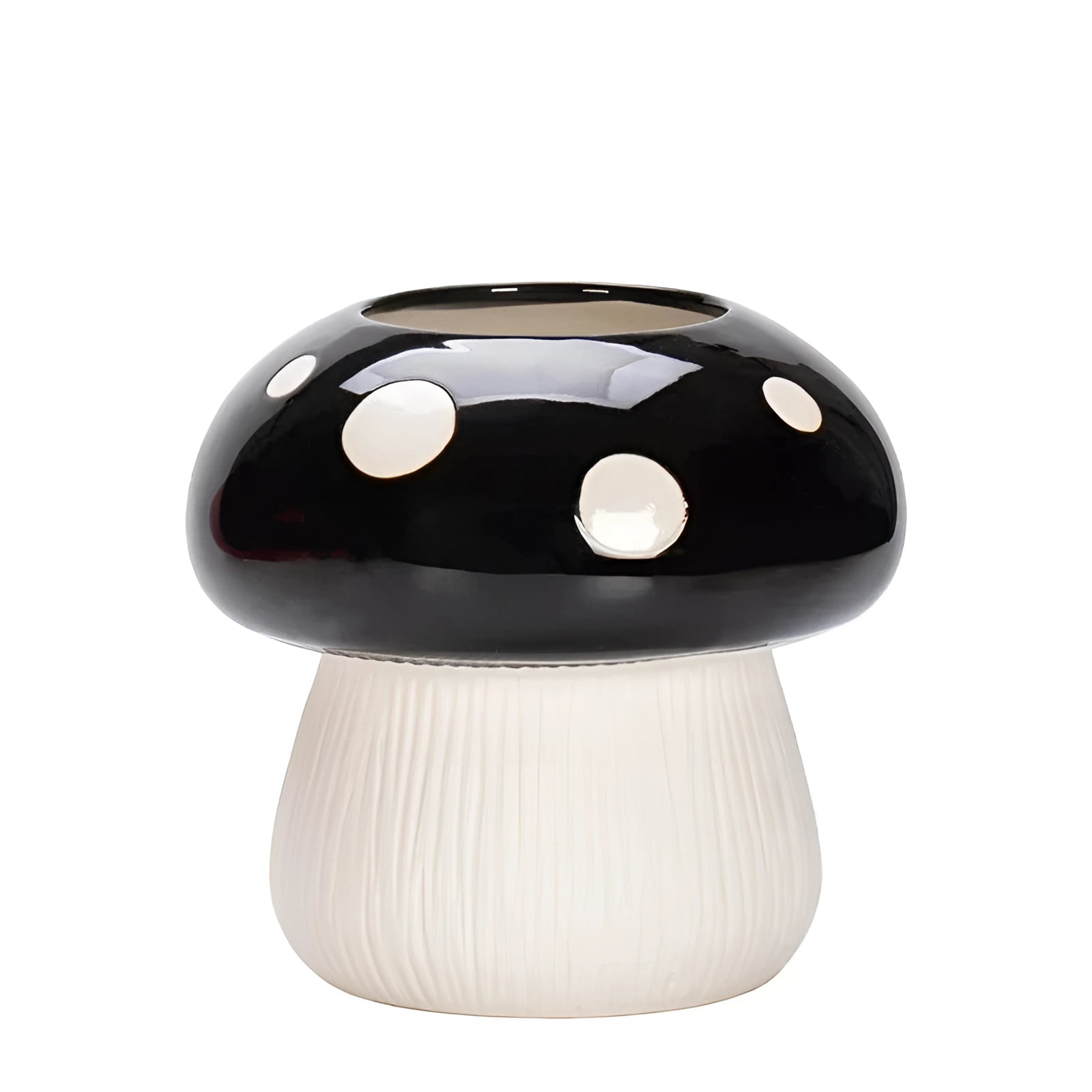 A whimsical Black & White Polka Dot Ceramic Mushroom Table Lamp with a rounded mushroom-shaped design, featuring a black base and a white top adorned with black polka dots, ideal for adding playful charm to interior decor.