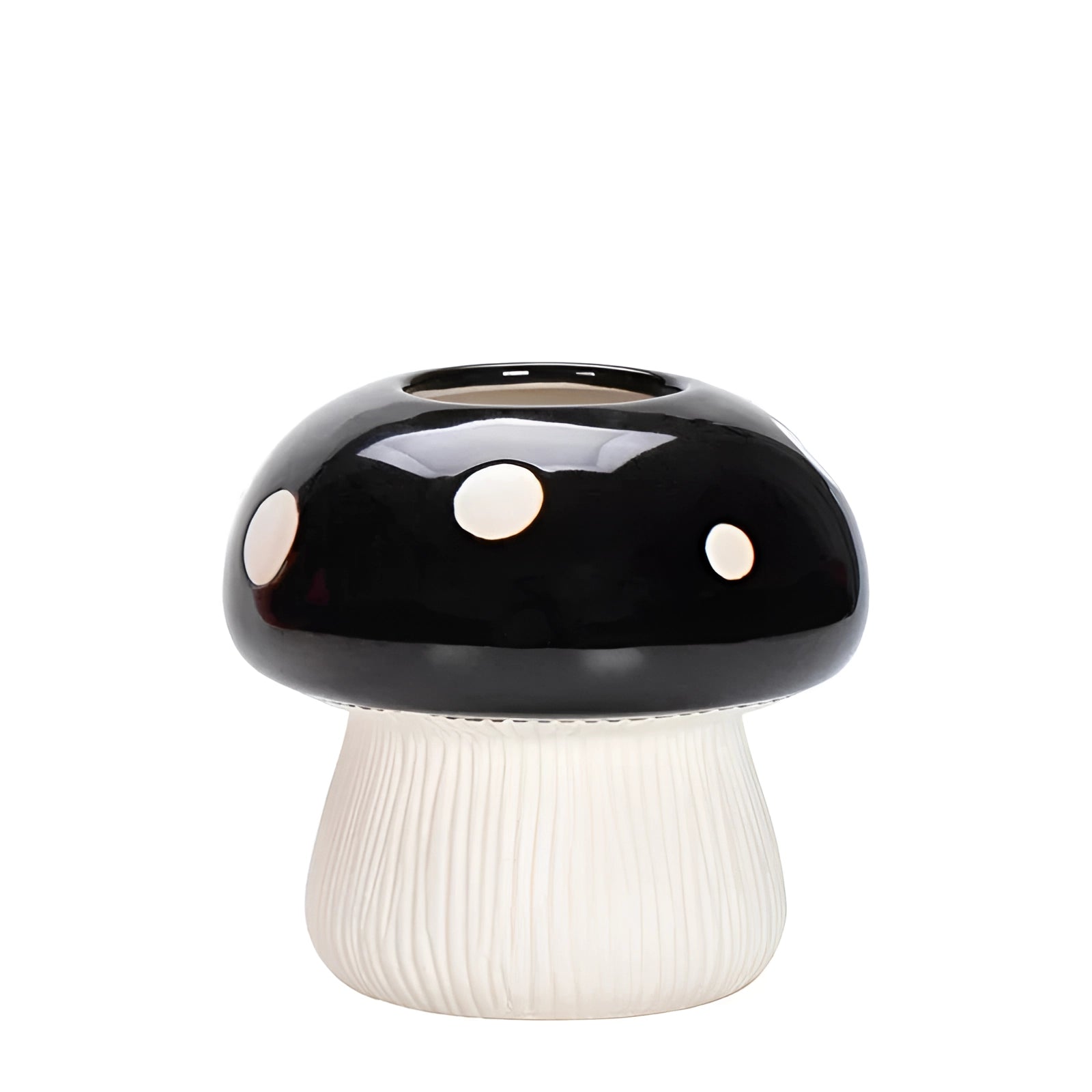 Black and white polka dot ceramic mushroom table lamp featuring a whimsical design with a black base and a mushroom-shaped shade, perfect for adding a playful touch to any room decor.