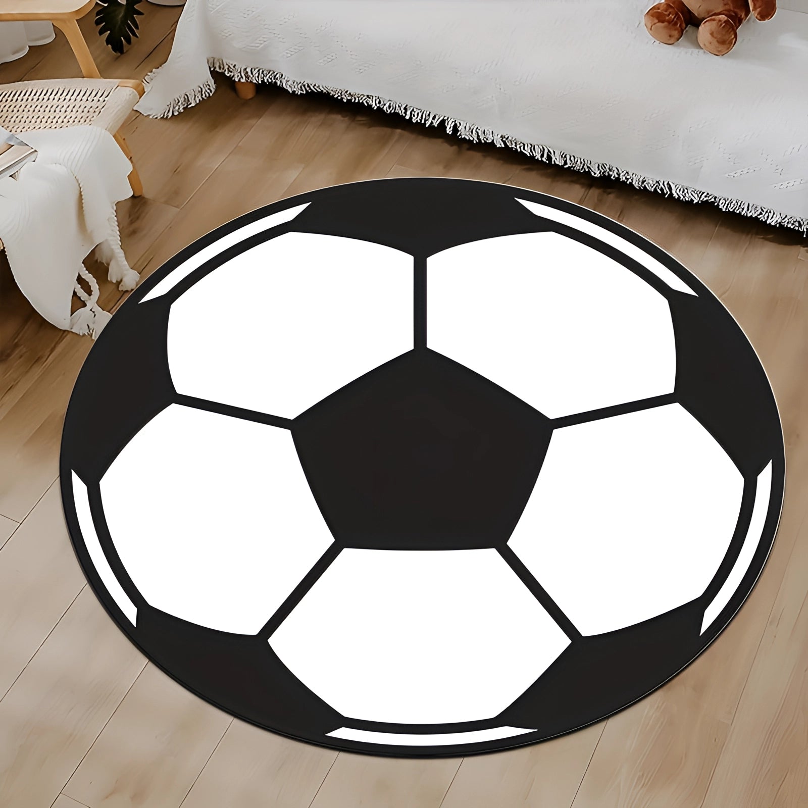 
Round black and white soccer ball rug with a symmetrical pattern, ideal for kids' room decor.