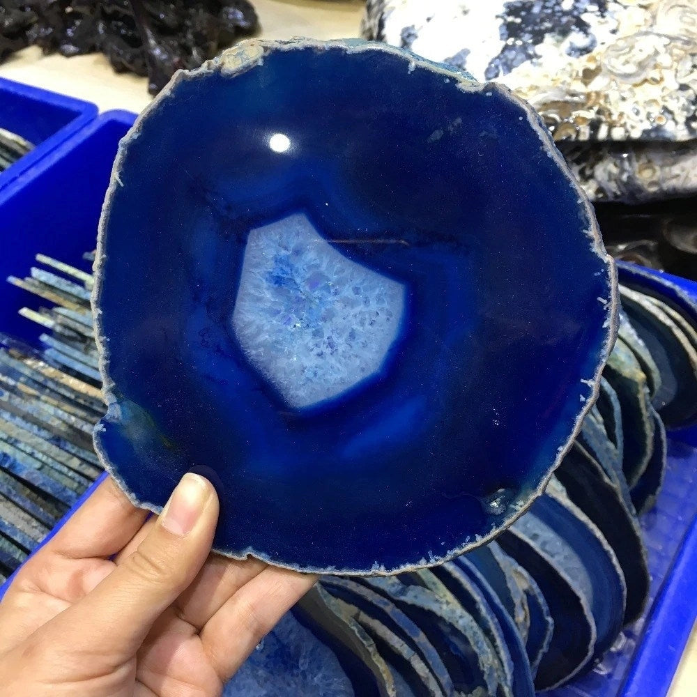 Blue agate geode plate with vivid electric blue hues, showcased as a luxurious and elegant serving plate or home decor piece.