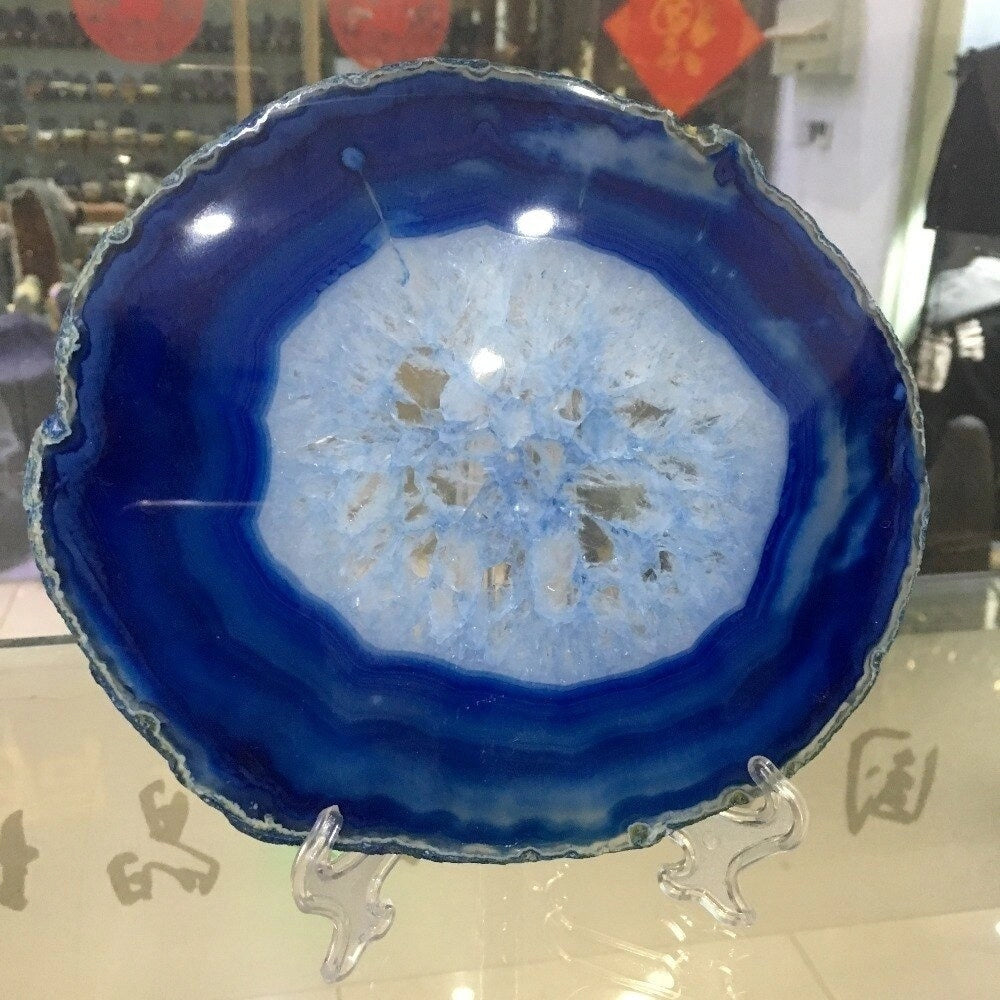 Blue agate geode plate with luxurious stone design, used as a decorative serving dish for home decor.