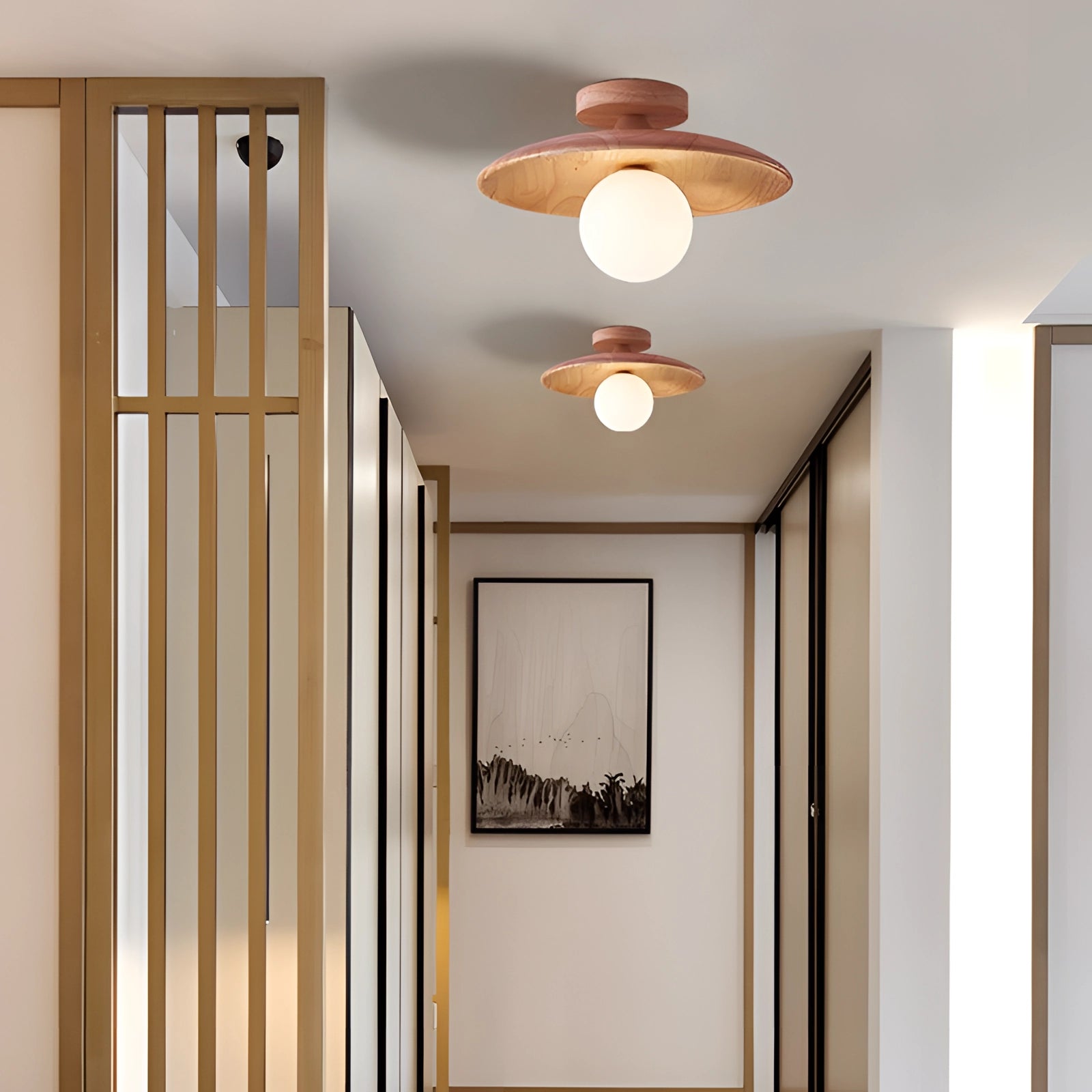 Bronze modern round flush mount ceiling light with a warm glow, installed in an interior space featuring wooden elements and contemporary design.