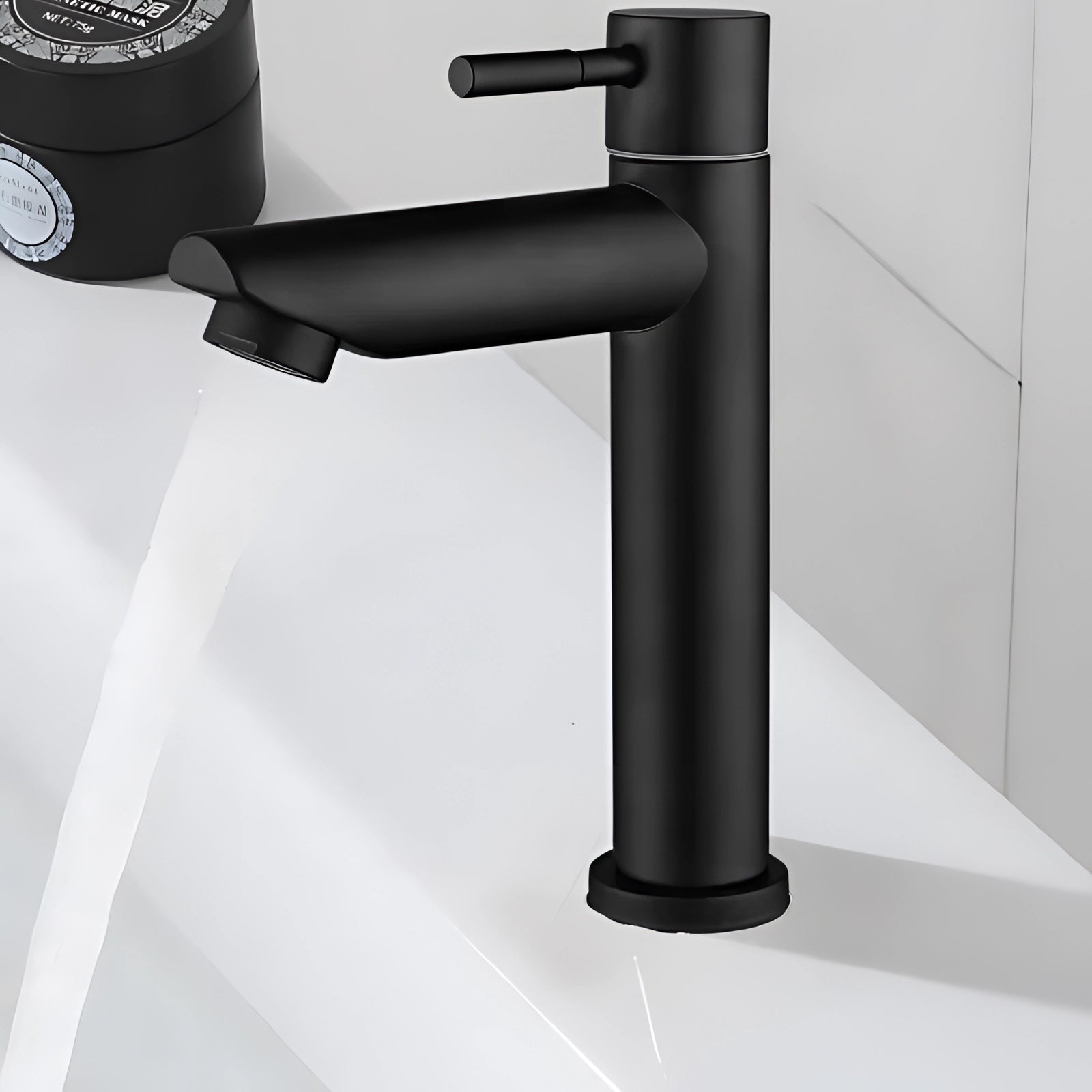 Single handle black and gold bathroom faucet with a contemporary luxury design, featuring a sleek and modern aesthetic.