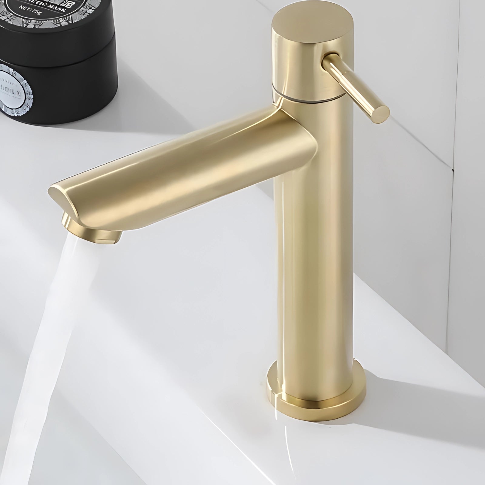 
A sleek contemporary luxury single handle gold bathroom faucet with a modern design, featuring a smooth and shiny metallic finish. The faucet is crafted from high-quality materials, showcasing a single lever handle for easy water flow and temperature control.