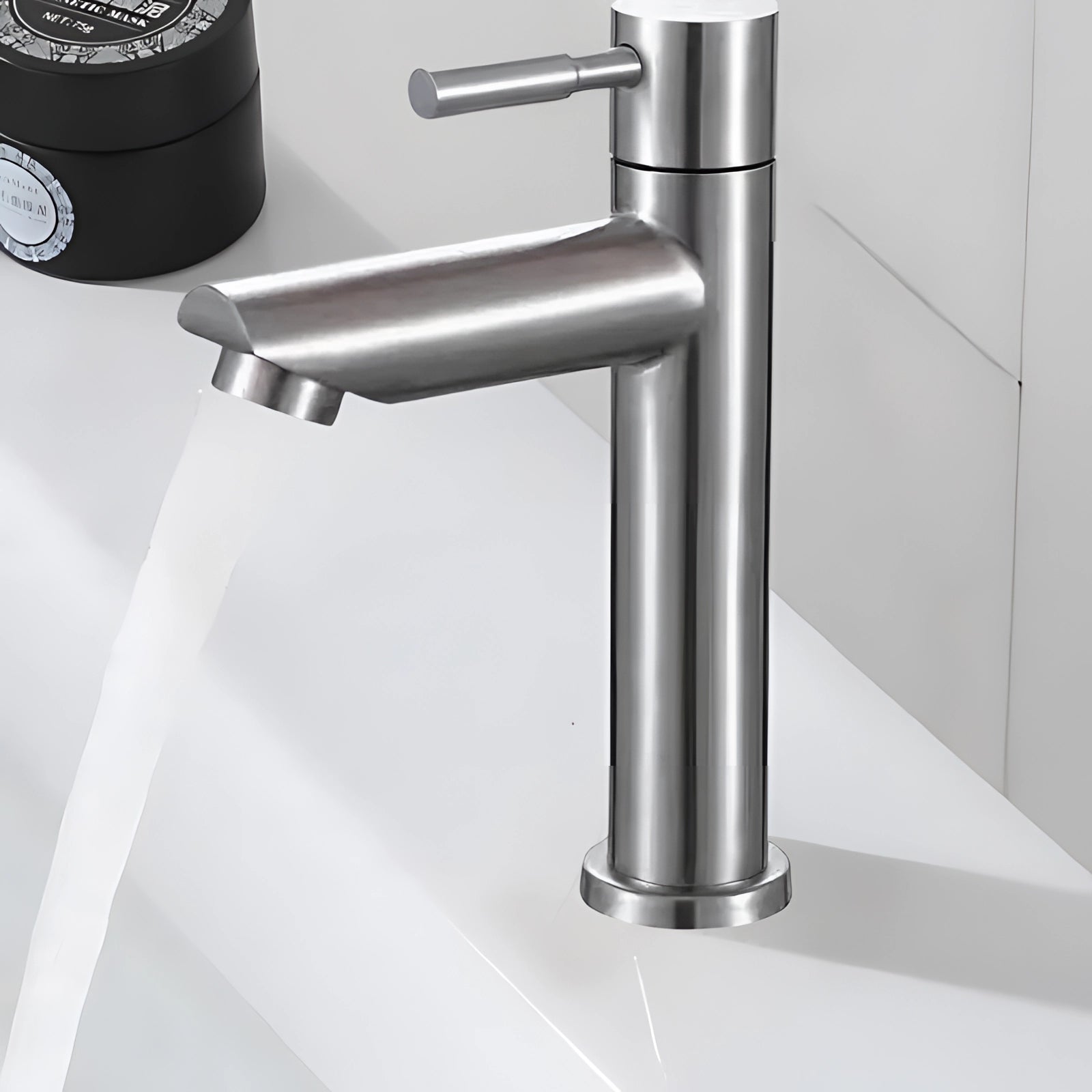 Single handle silver bathroom faucet with a contemporary luxury design, made of metal materials like nickel and aluminium.