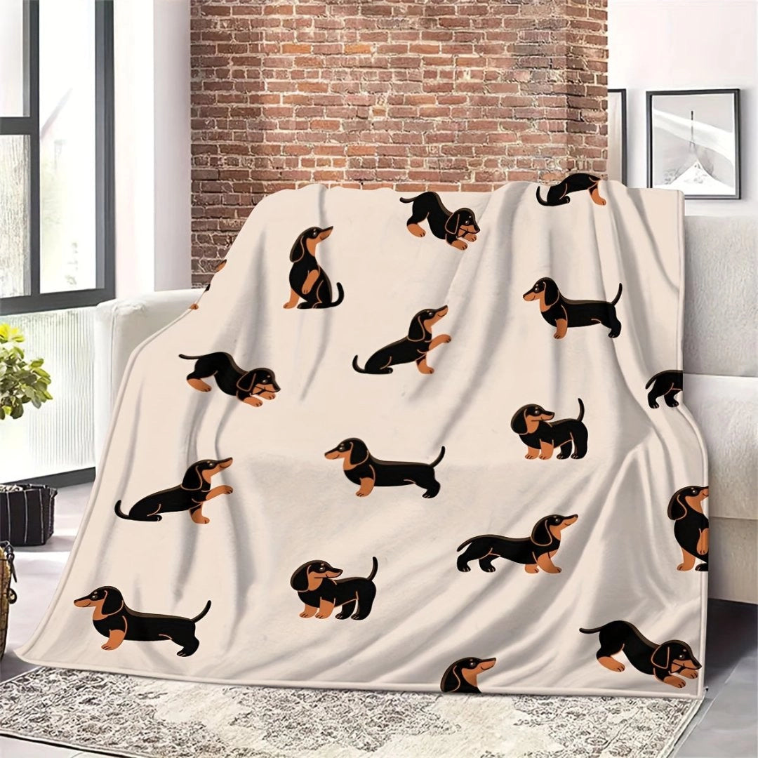 A cozy and artistic dachshund-themed fleece blanket in shades of brown and orange, draped over a wooden floor next to a window with a view of plants, creating a warm interior design atmosphere.