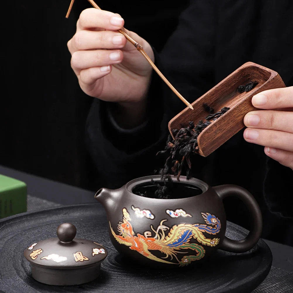 Hand-painted Chinese ceramic teapot featuring a dragon design and crafted with heat-resistant material, suitable for serving tea.