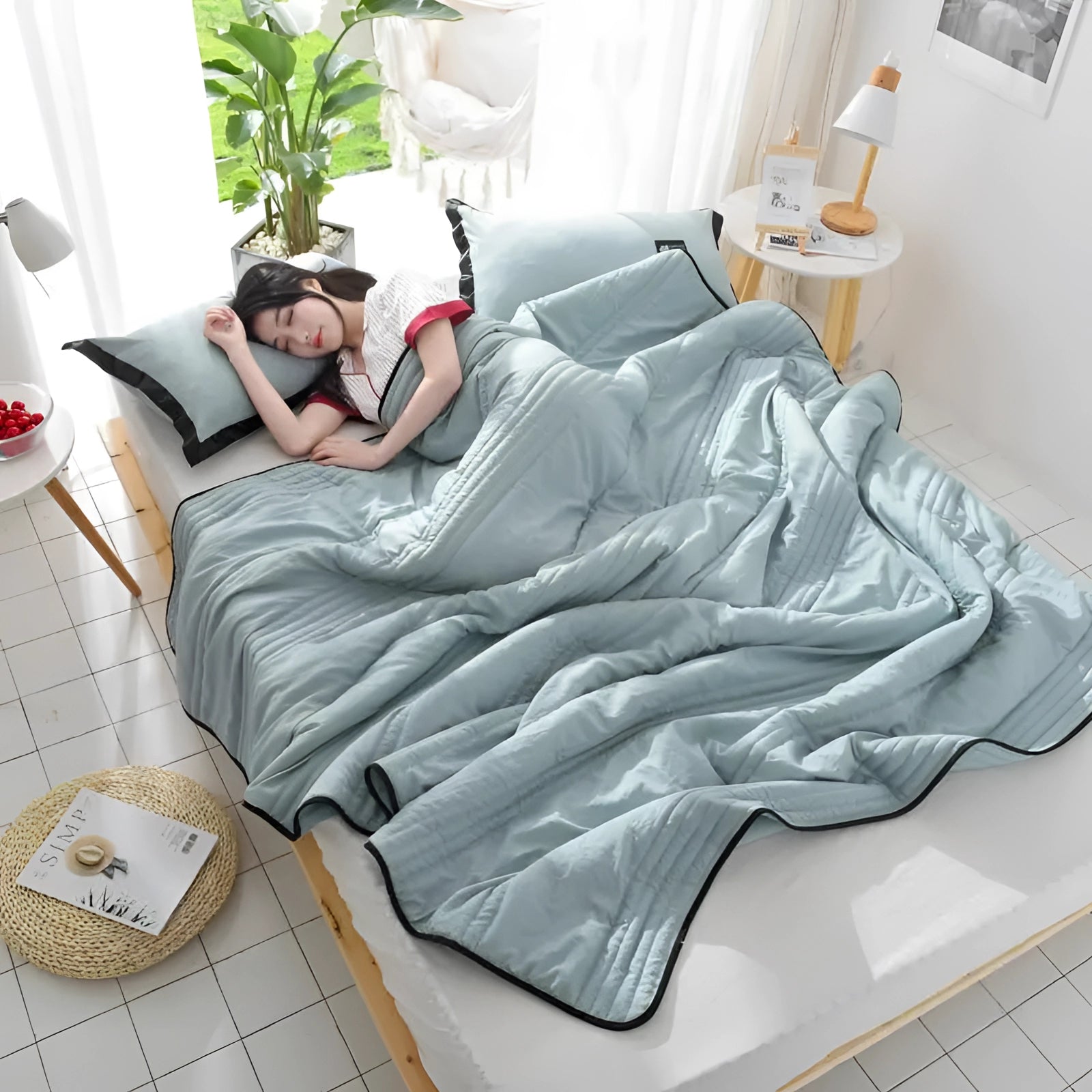 Eco-friendly bamboo cooling blanket draped over a white couch in a cozy interior setting with a houseplant beside it, highlighting its lightweight and breathable qualities.