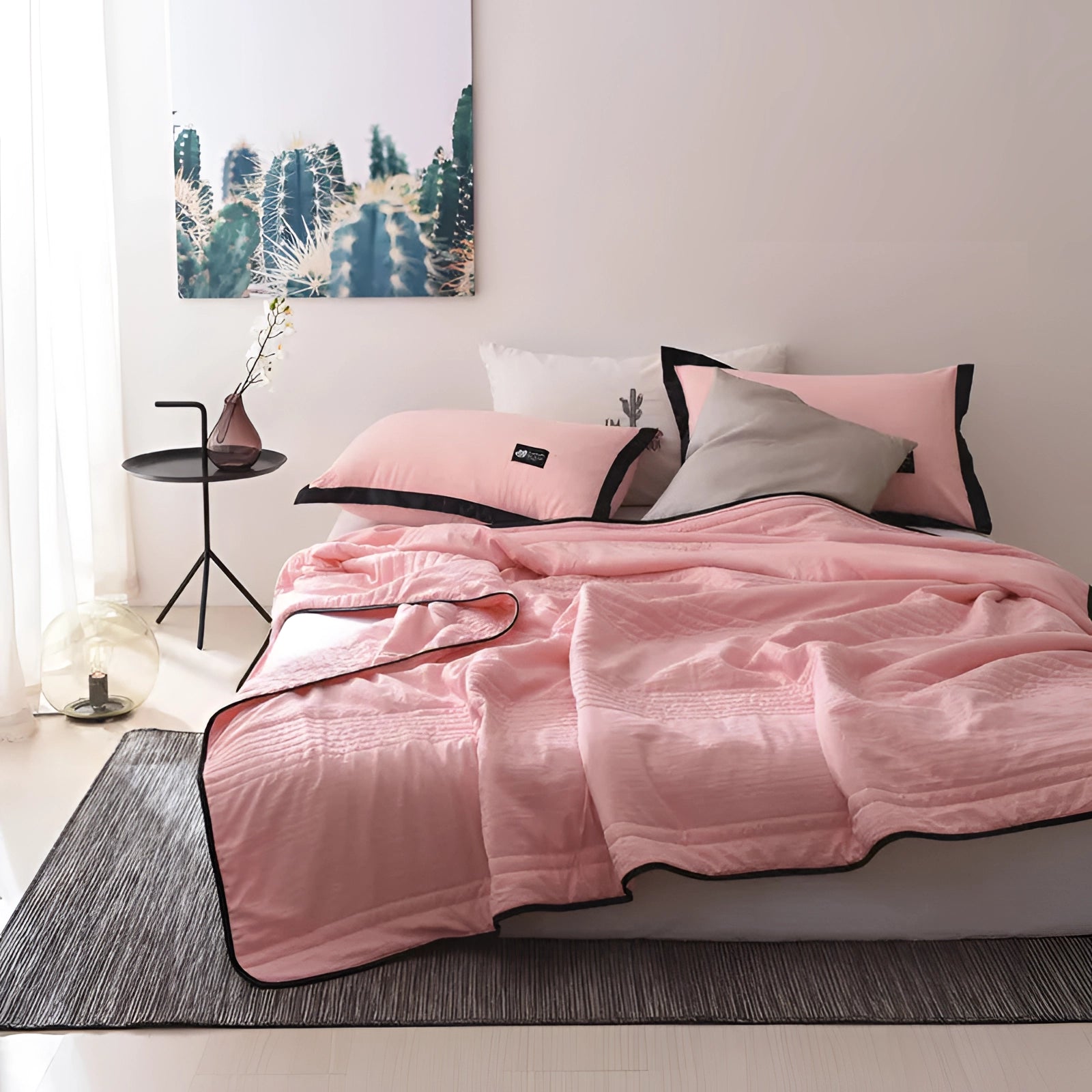 Pink eco-friendly bamboo cooling blanket, lightweight and breathable, draped over a bed with a wooden bed frame, measuring 200 x 230 cm in a cozy room setting.