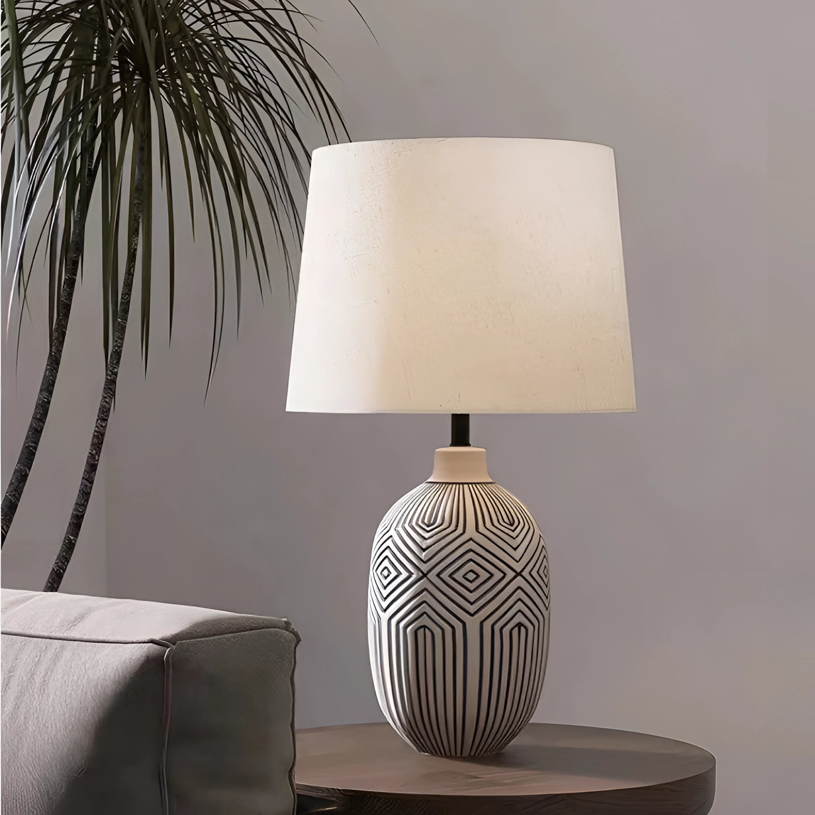 Elegant geometric ceramic lamp with a modern design, featuring a rectangular shape, wooden base, and a white lampshade, ideal for contemporary home decor and interior design.