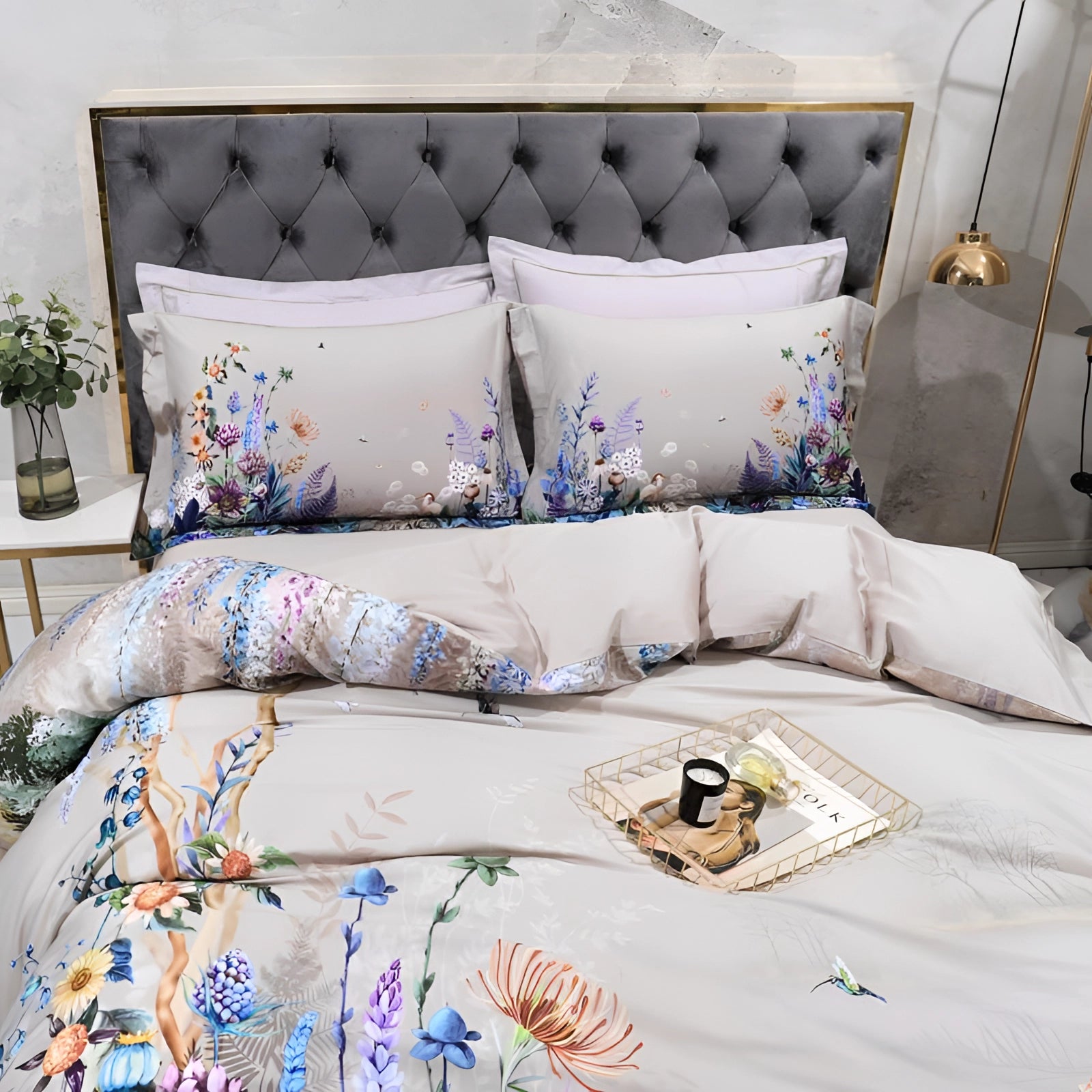 Floral bedding set featuring a designer duvet and comforter in an elegant decor setting, with white and azure tones, textile pattern, and decorative flowerpot, enhancing comfort with plush pillows.