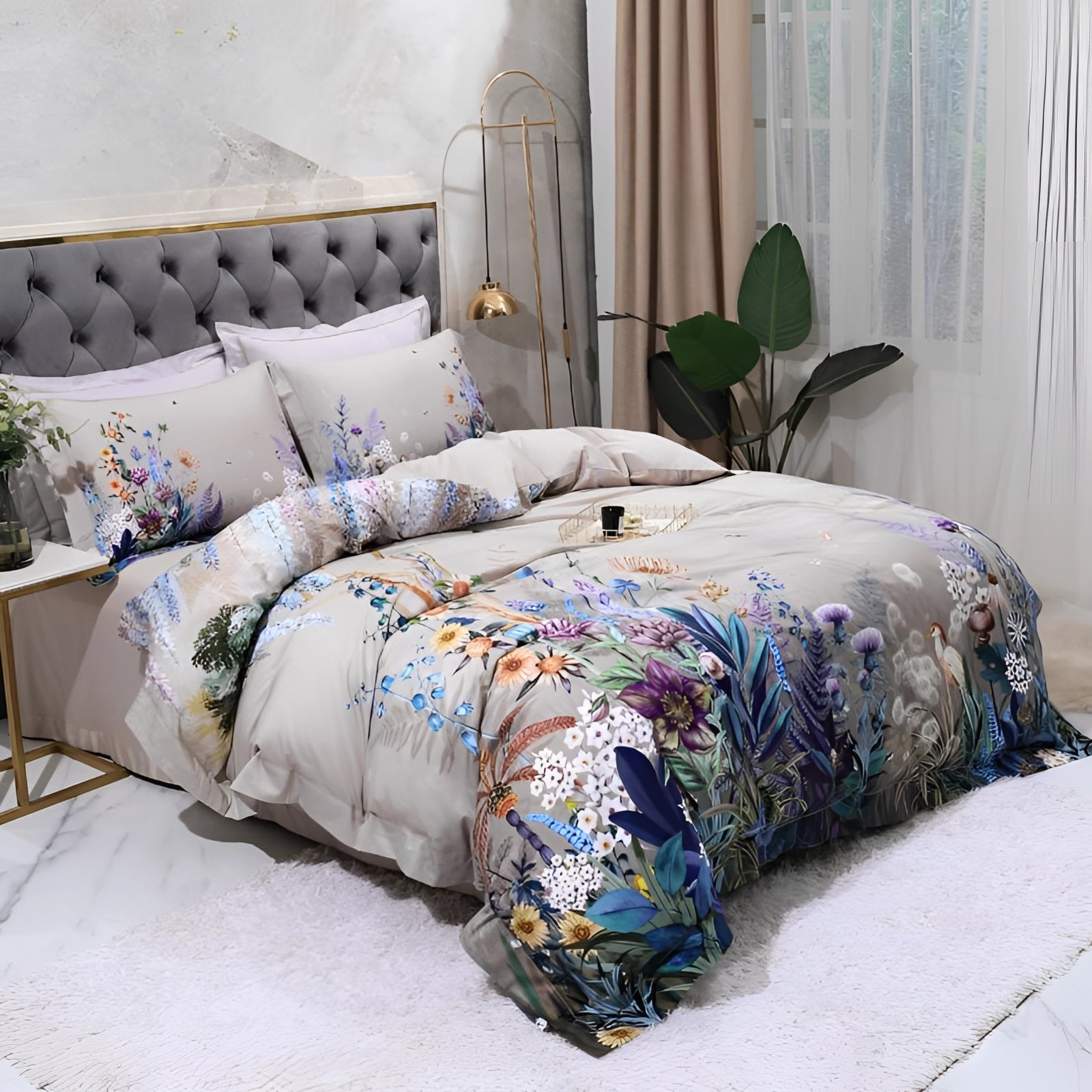 Elegant floral bedding set displayed in a cozy, stylish bedroom with grey tones, featuring a designer duvet and comforter, complemented by pillows and decor, surrounded by wooden furniture and a window view.