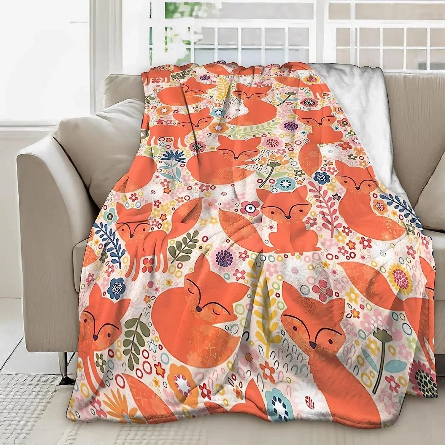 
A cozy Fox Print Throw Blanket featuring a cute woodland design in orange hues, perfect for adding a touch of comfort and charm to both kids' and adults' spaces.