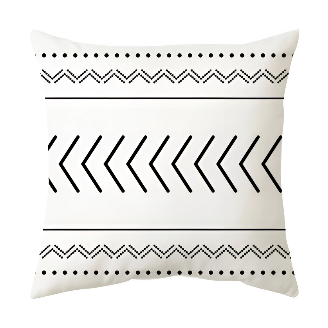 Geometric black and white pillow with modern abstract design featuring various shapes such as triangles and circles, measuring 60 x 60 cm.