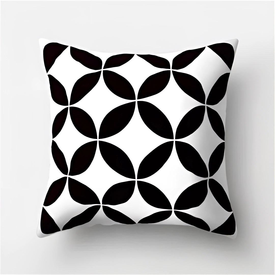 Geometric black and white pillow featuring a modern abstract pattern with symmetrical circle and rectangle motifs, measuring 60 x 60 cm.