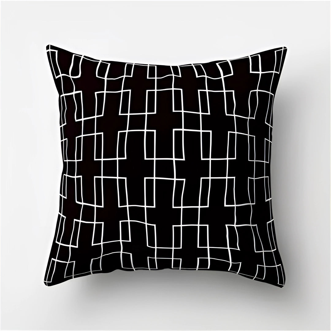 Geometric black and white throw pillow featuring a modern abstract pattern with symmetrical design, ideal for contemporary decor, size 60 x 60 cm.