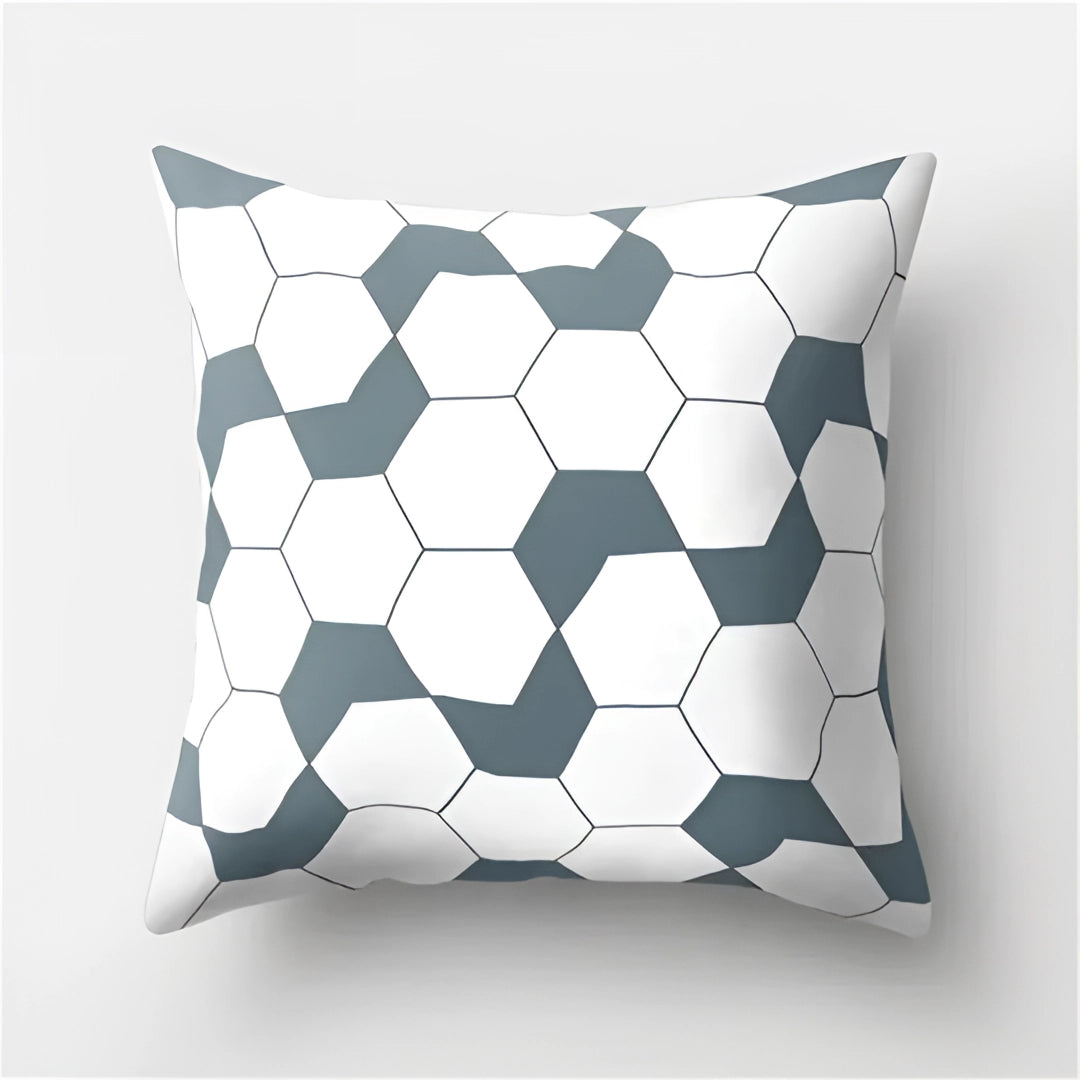 Geometric black and white pillow with modern abstract design featuring triangles and other shapes, suitable for contemporary decor, sized 60 x 60 cm.